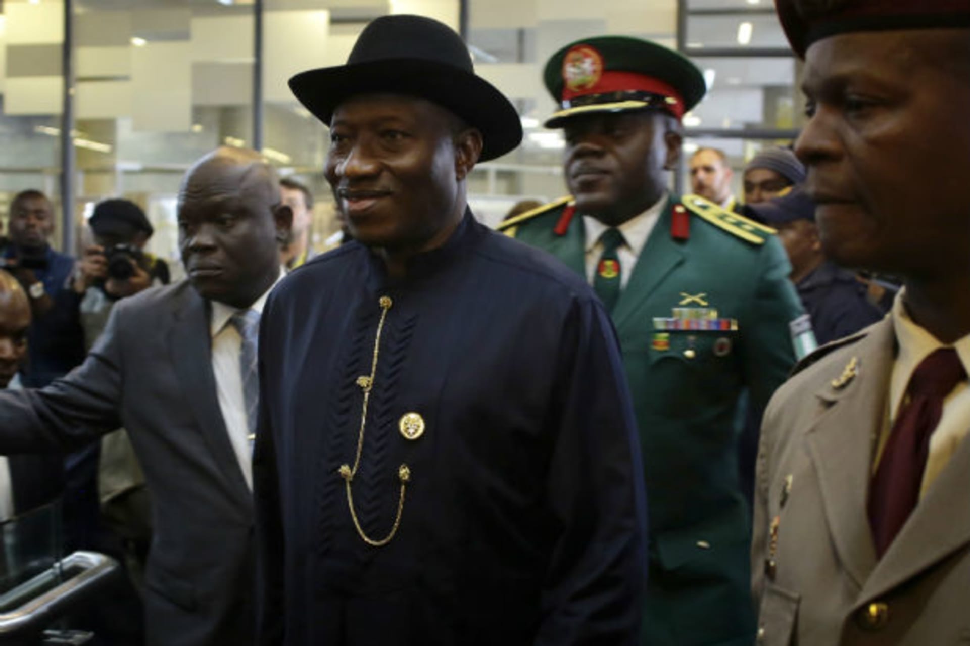 Nigeria's President Goodluck Jonathan (C) arrives for the service for former South African President Nelson Mandela at the First National Bank Stadium, also known as Soccer City, in Johannesburg December 10, 2013.