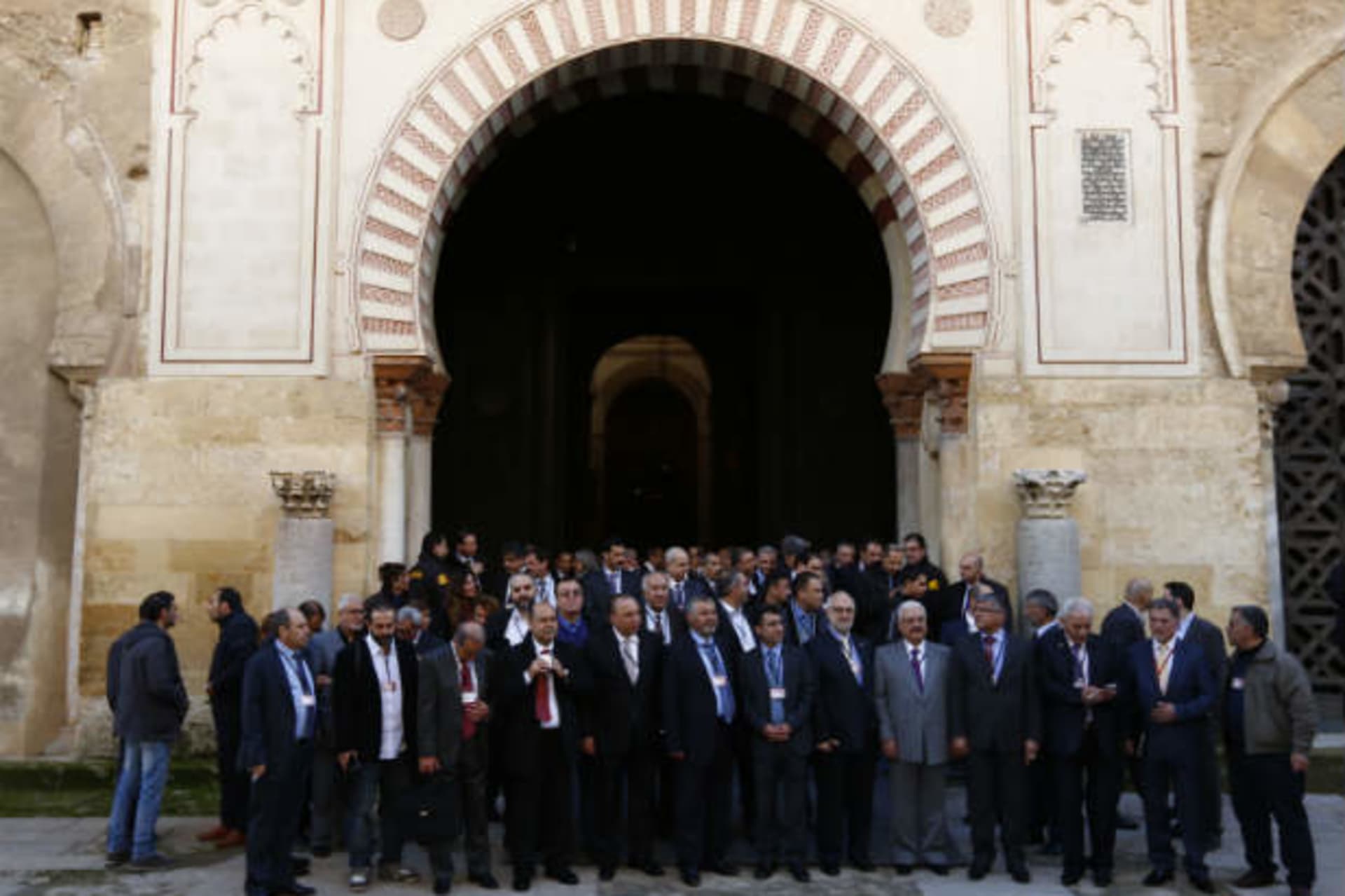 Members of Syrian opposition groups stand after visiting the former mosque of Cordoba during a consultative meeting in Cordoba, southern Spain January 9, 2014 (del Pozo/Courtesy Reuters).