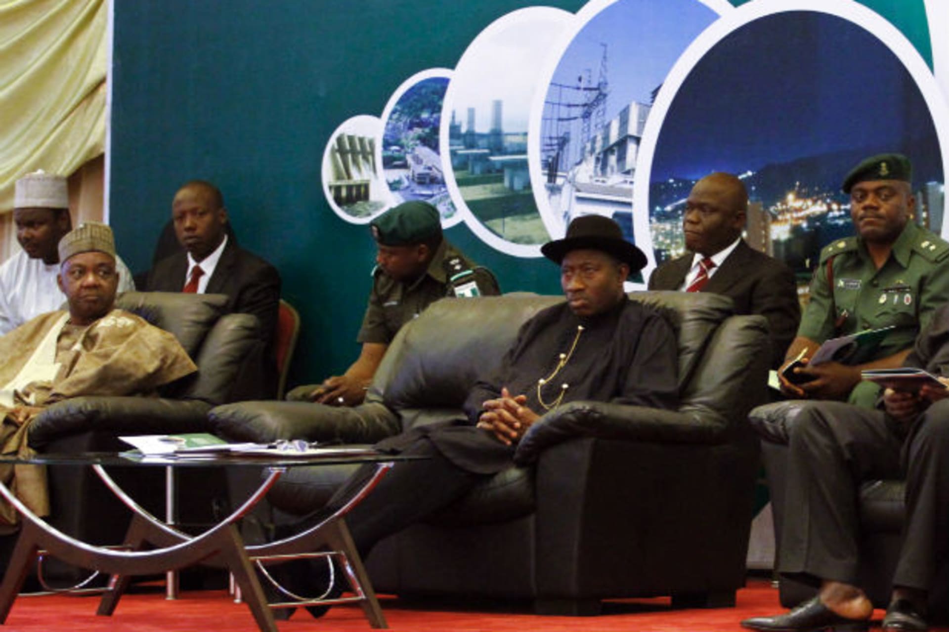 (Front seated, from L to R) Nigeria's Vice President Namadi Sambo, President Goodluck Jonathan and Secretary to the Government of the Federation (SGF) Anyim Pius Anyim attend the opening of the Presidential Power Reform Transaction signing summ