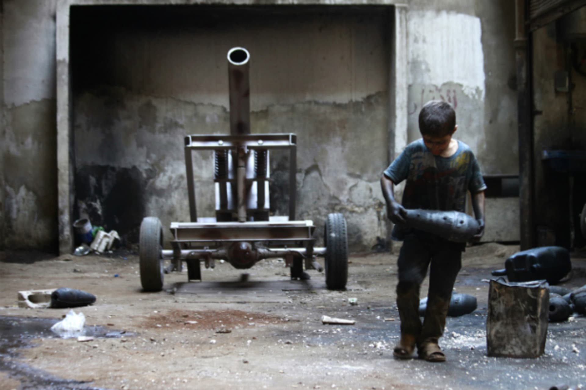 <p>Child with Mortar Shell in Aleppo</p>
