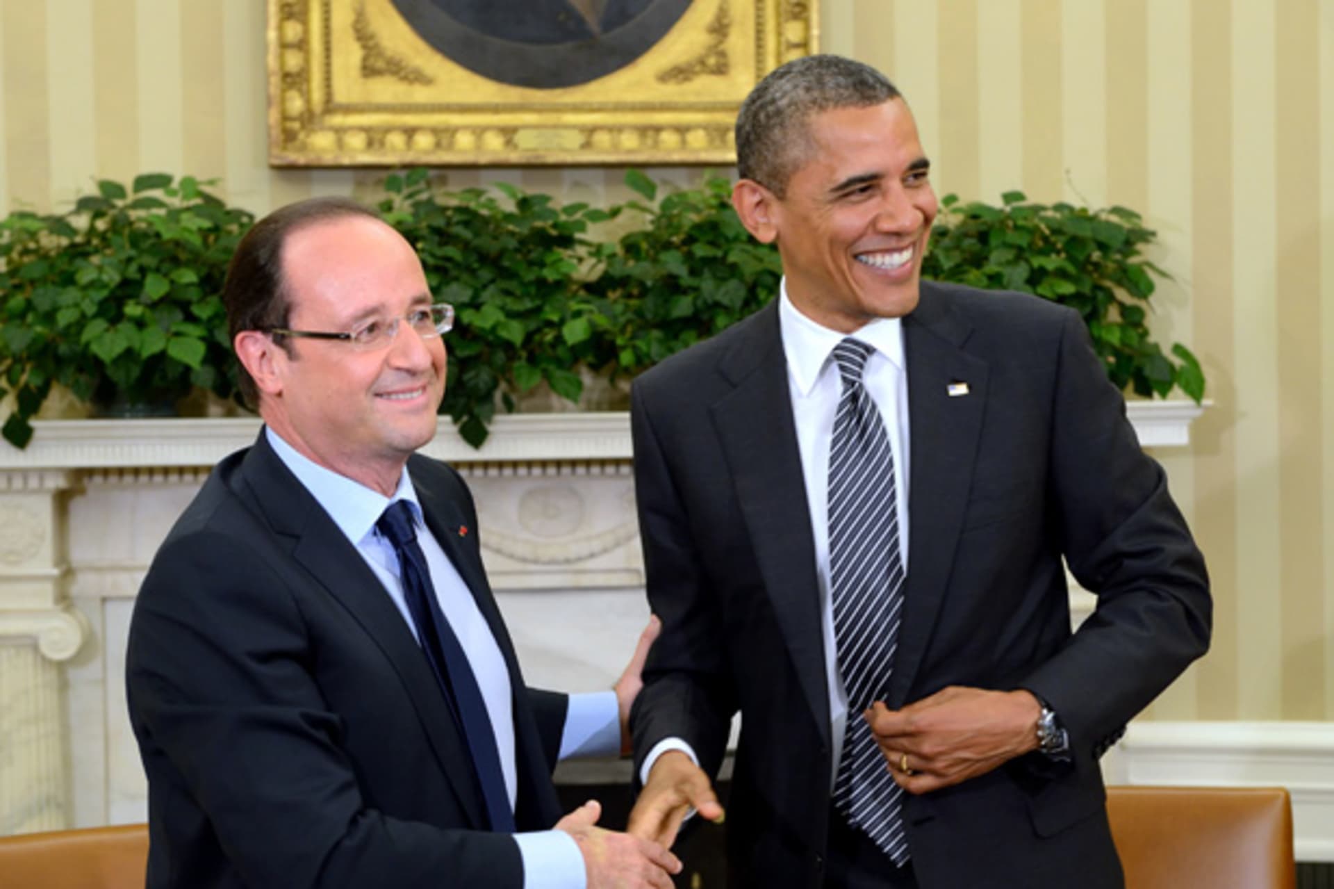 <p>U.S. president Barack Obama shakes hands with French president Francois Hollande after a meeting in the Oval Office in 2012. (Eric Feferberg/Courtesy Reuters)</p>
