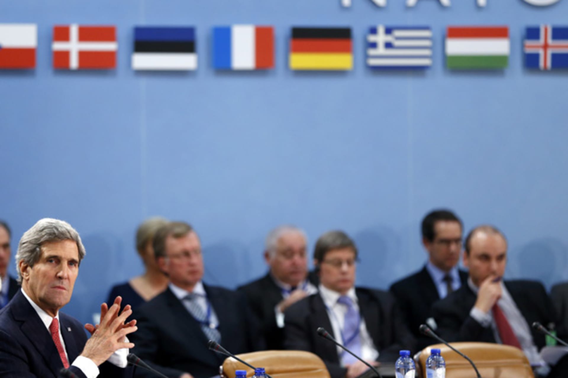 <p>U.S. secretary of state John Kerry attends a NATO foreign ministers meeting in December. (Francois Lenoir/Courtesy Reuters)</p>
