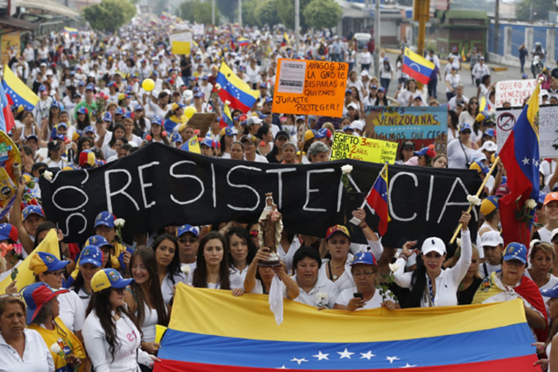 <p>Demonstrators protest the Venezuelan government in San Cristobal, about 410 miles southwest of Caracas. (Carlos Garcia/Courtesy Reuters).</p>
