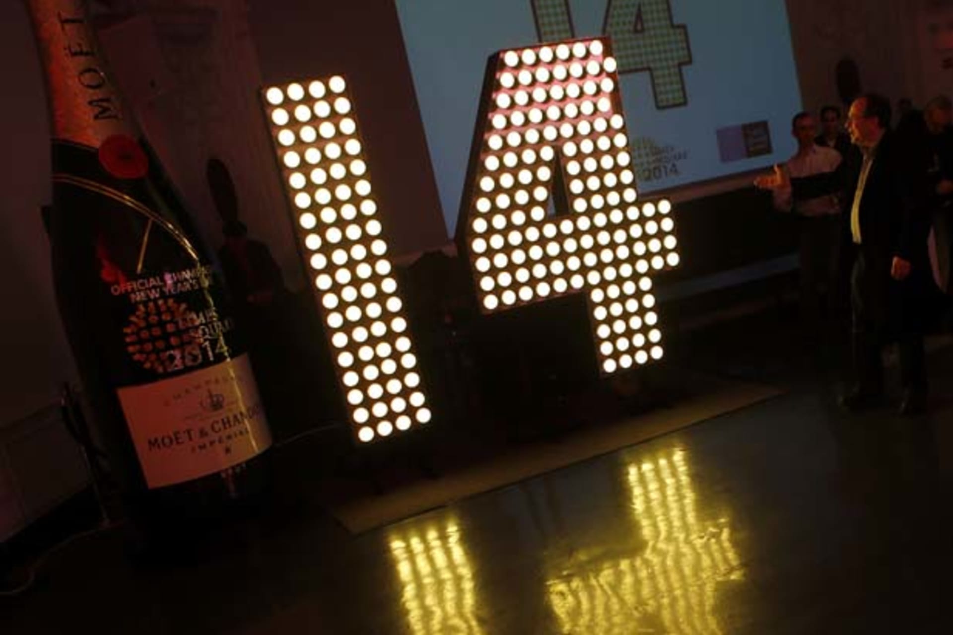 <p>Tim Tompkins, president of the Times Square Alliance, unveils part of the “2014” sign that will light up Times Square at midnight on New Year’s Eve. (Mike Segar/Courtesy Reuters)</p>
