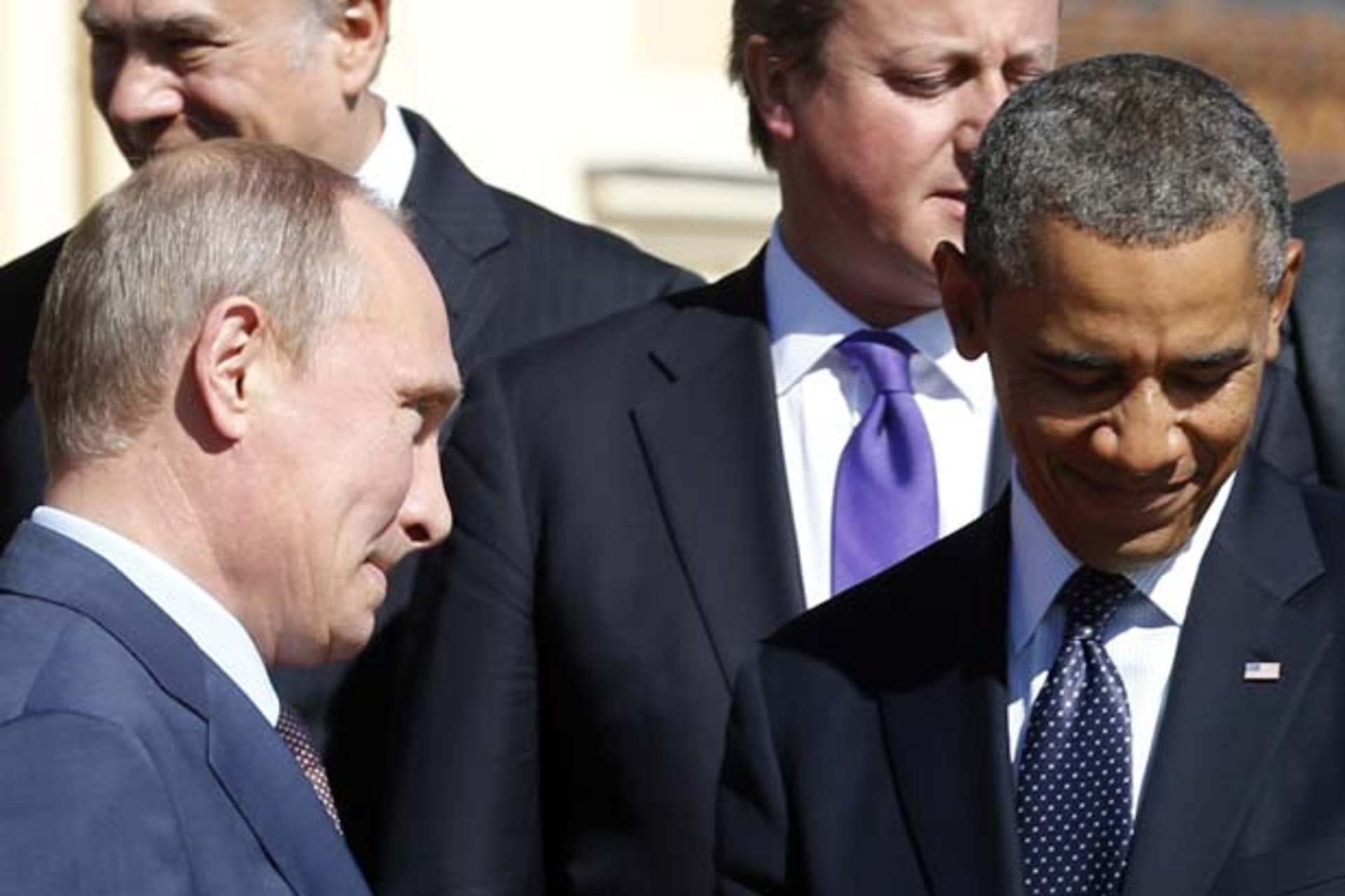 <p>Russian president Vladimir Putin walks past U.S. president Barack Obama during a group photo at the G20 summit in St. Petersburg (Kevin Lamarque/Courtesy Reuters).</p>