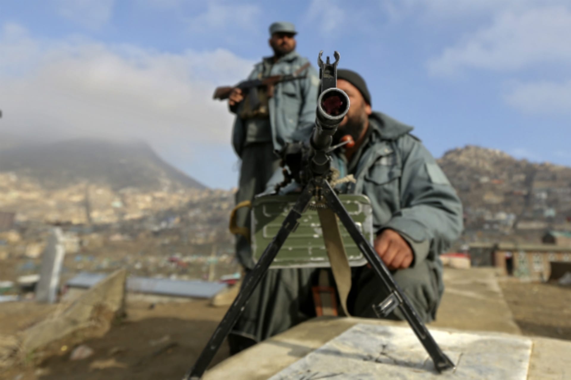 Afghan policemen keep watch during celebrations for Afghan New Year. (Sobhani/Courtesy Reuters)