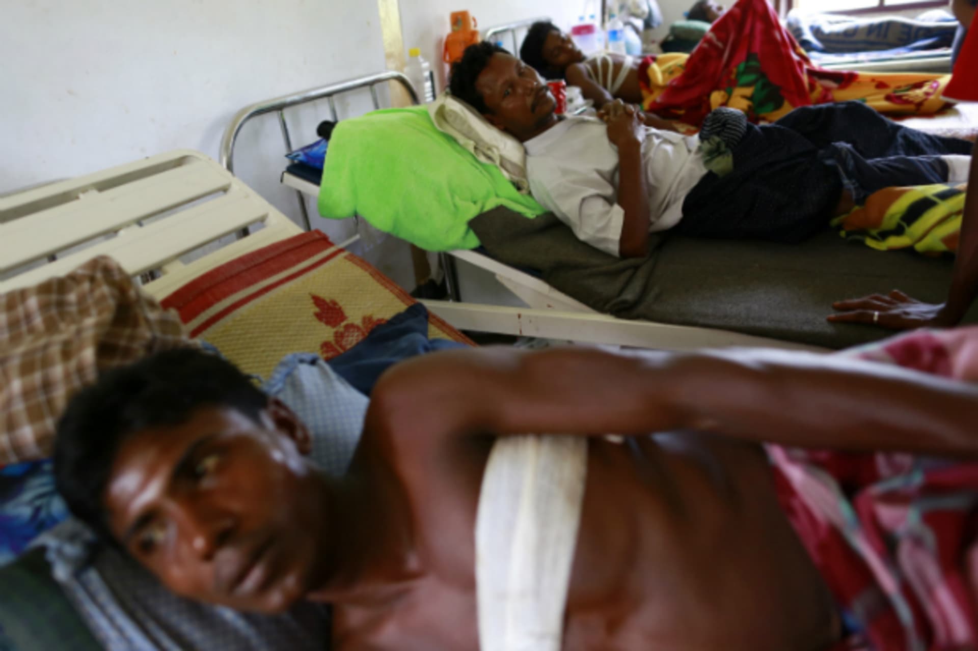 <p>Rohingya men who were shot by the police during a riot on Friday rest in Dapaing district clinic, outside of Sittwe, on August…third time in two months, reviving tensions in a region beset by religious violence last year. (Soe Zeya Tun/Courtesy Reuters)</p>
