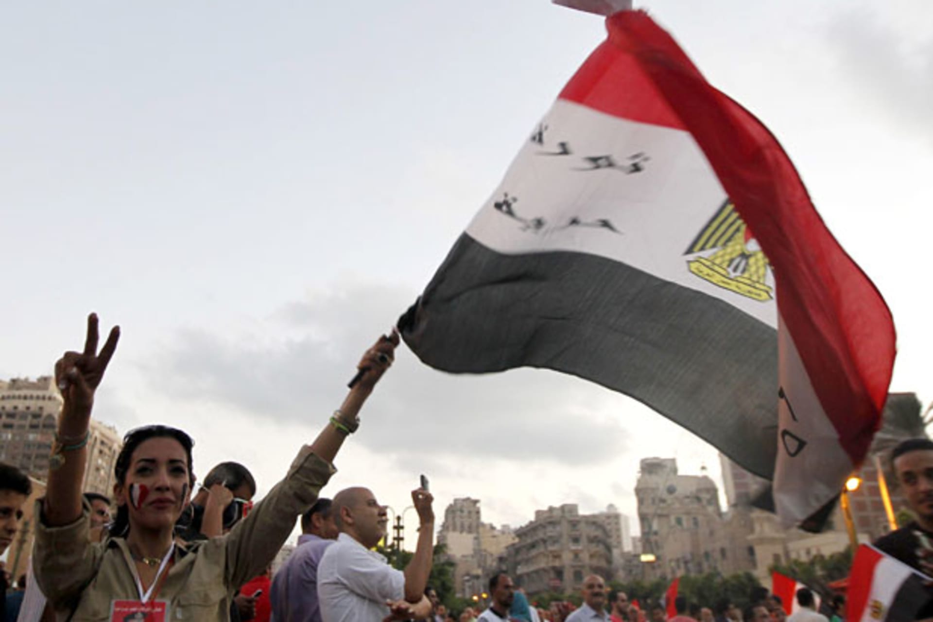 <p>Opponents of ousted Egyptian president Mohamed Morsi celebrate in Alexandria on July 7 (Louafi Larbi/Courtesy Reuters).</p>