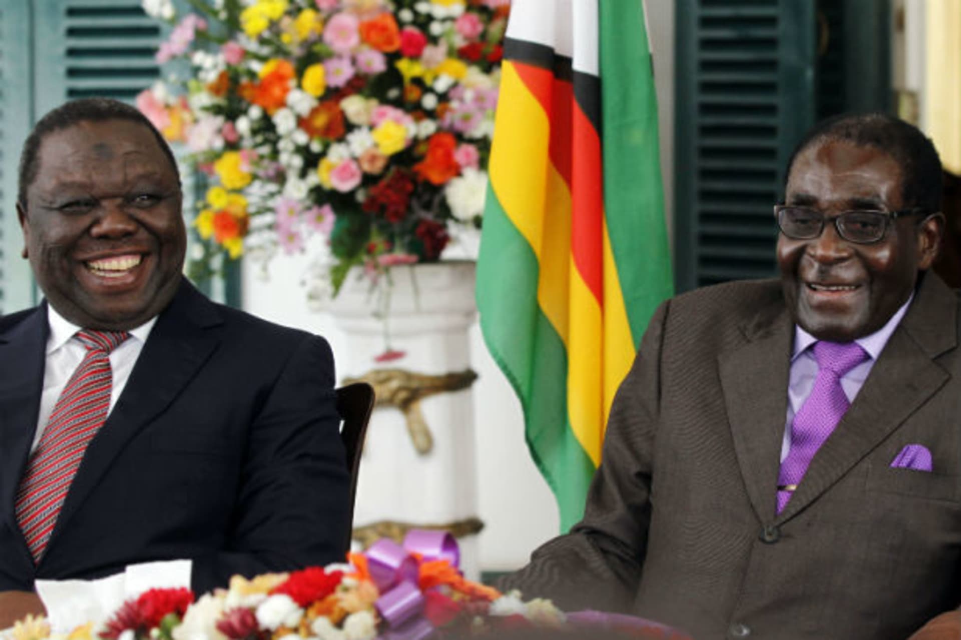 Zimbabwean President Robert Mugabe (R) and Prime Minister Morgan Tsvangirai address a media conference at State House in the capital Harare January 17, 2013.