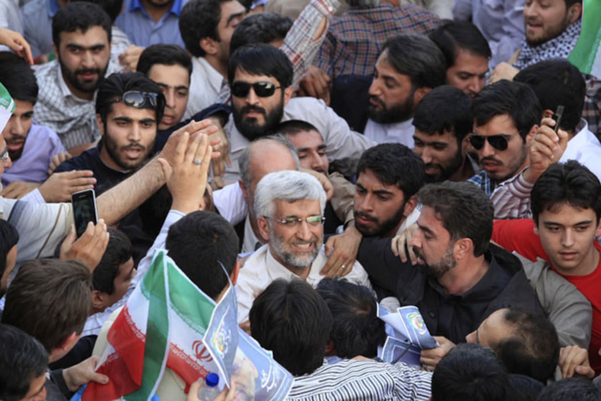 <p>Supporters crowd around Iranian presidential candidate Saeed Jalili during a rally in Tehran on June 12 (Yalda Moayeri/Courtesy Reuters).</p>