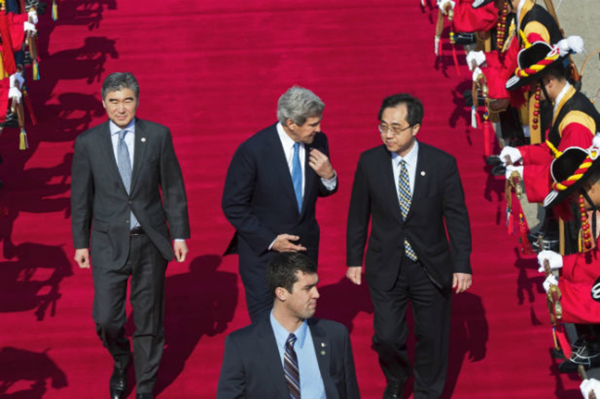 <p>U.S. Secretary of State John Kerry speaks with U.S. Ambassador to South Korea Sung Y. Kim at Seoul Air Base (Paul J. Richards/Courtesy Reuters).</p>

