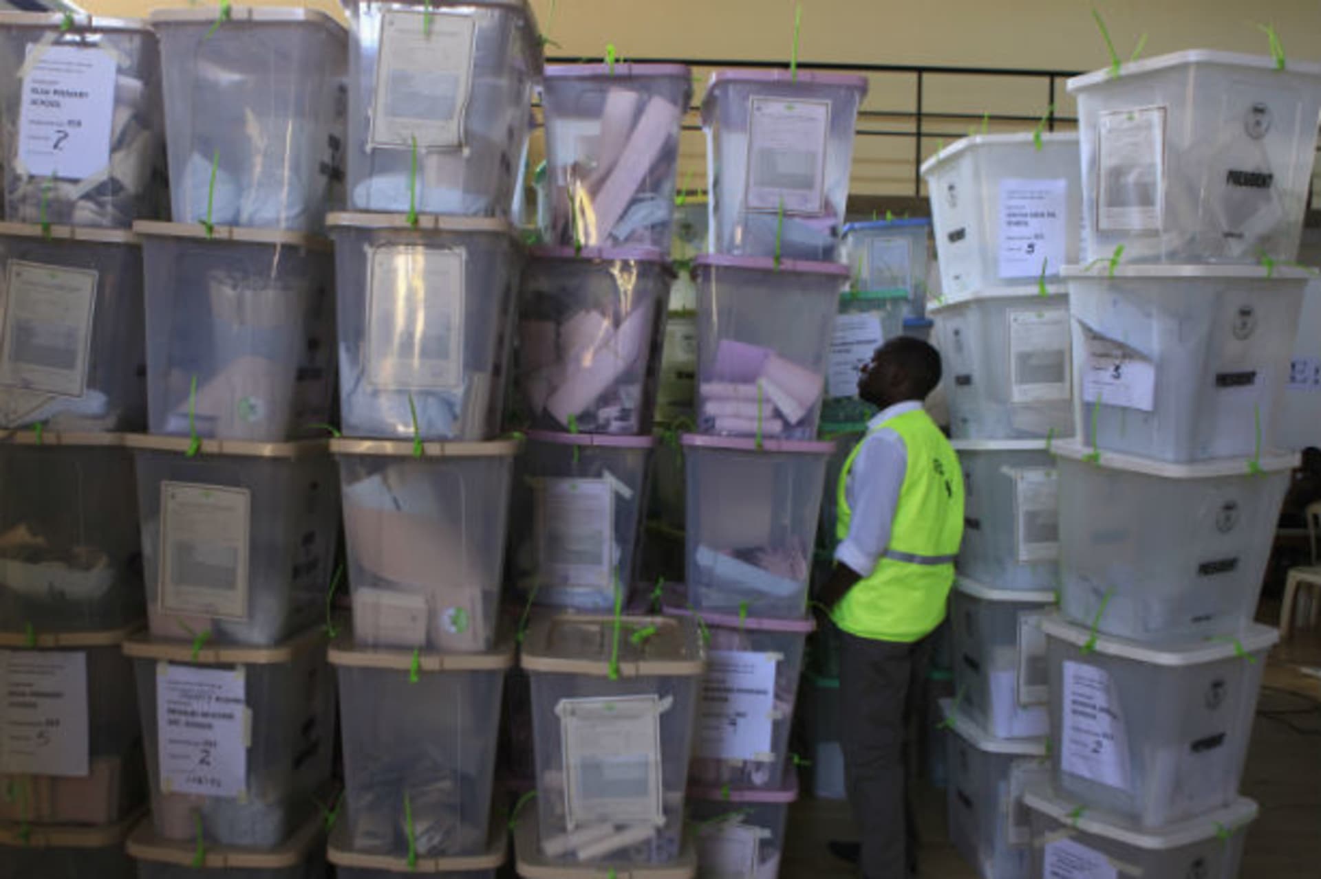 An official from the Independent Electoral and Boundaries Commission (IEBC) inspects ballot boxes at Kasarani gymnasium in Kenya's capital Nairobi March 5, 2013.