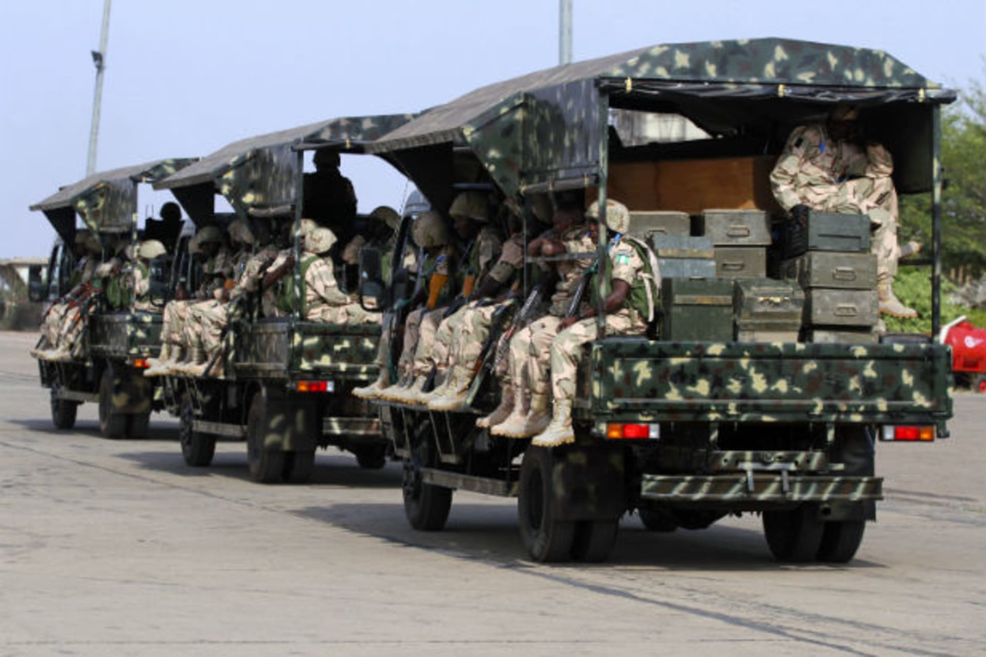Nigerian soldiers sit in military trucks before leaving for Mali, at the airport in Nigeria 18/01/2013.