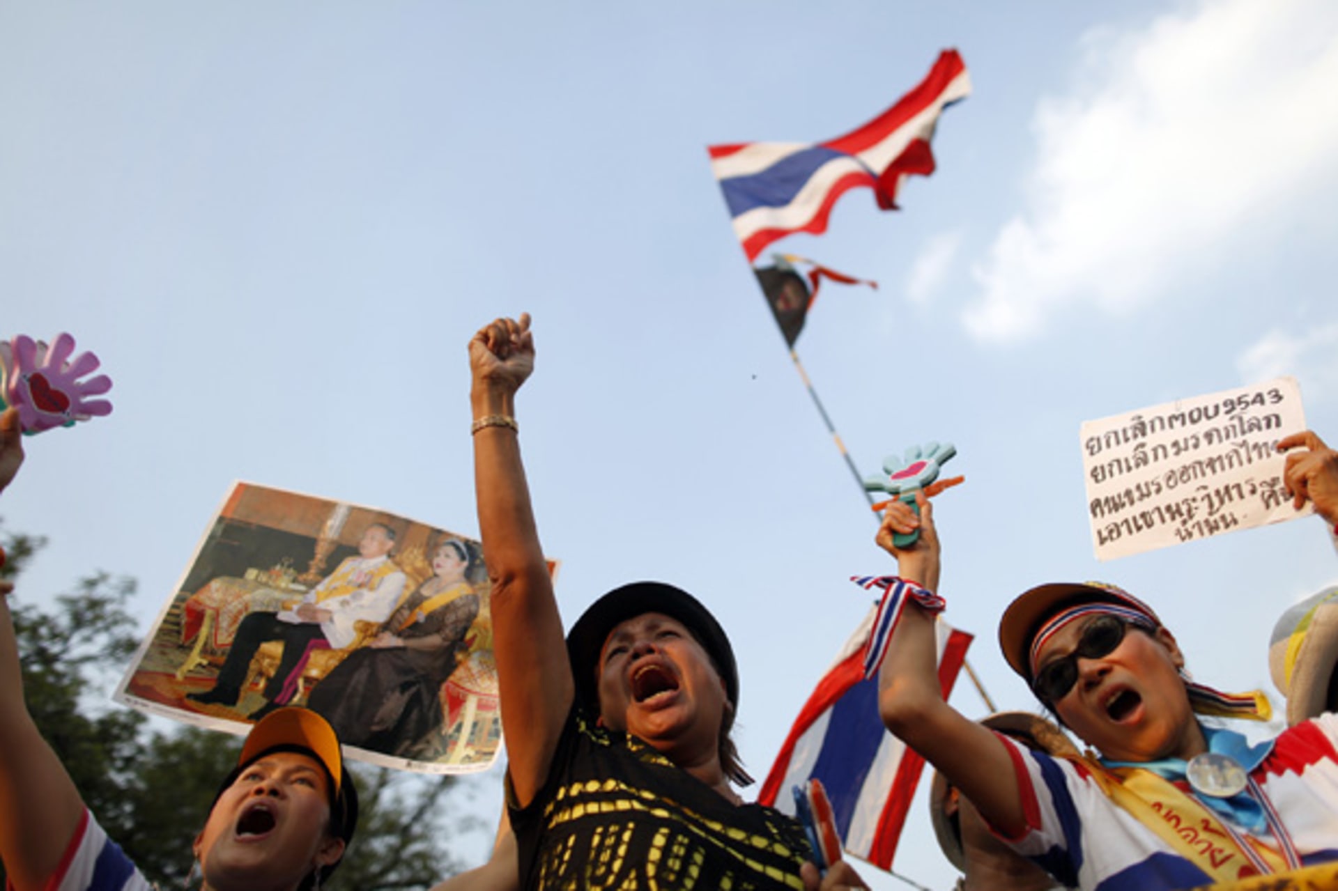 <p>Supporters of yellow-shirted People’s Alliance for Democracy react to the speech from the stage during a rally near the Government house in Bangkok.</p>
