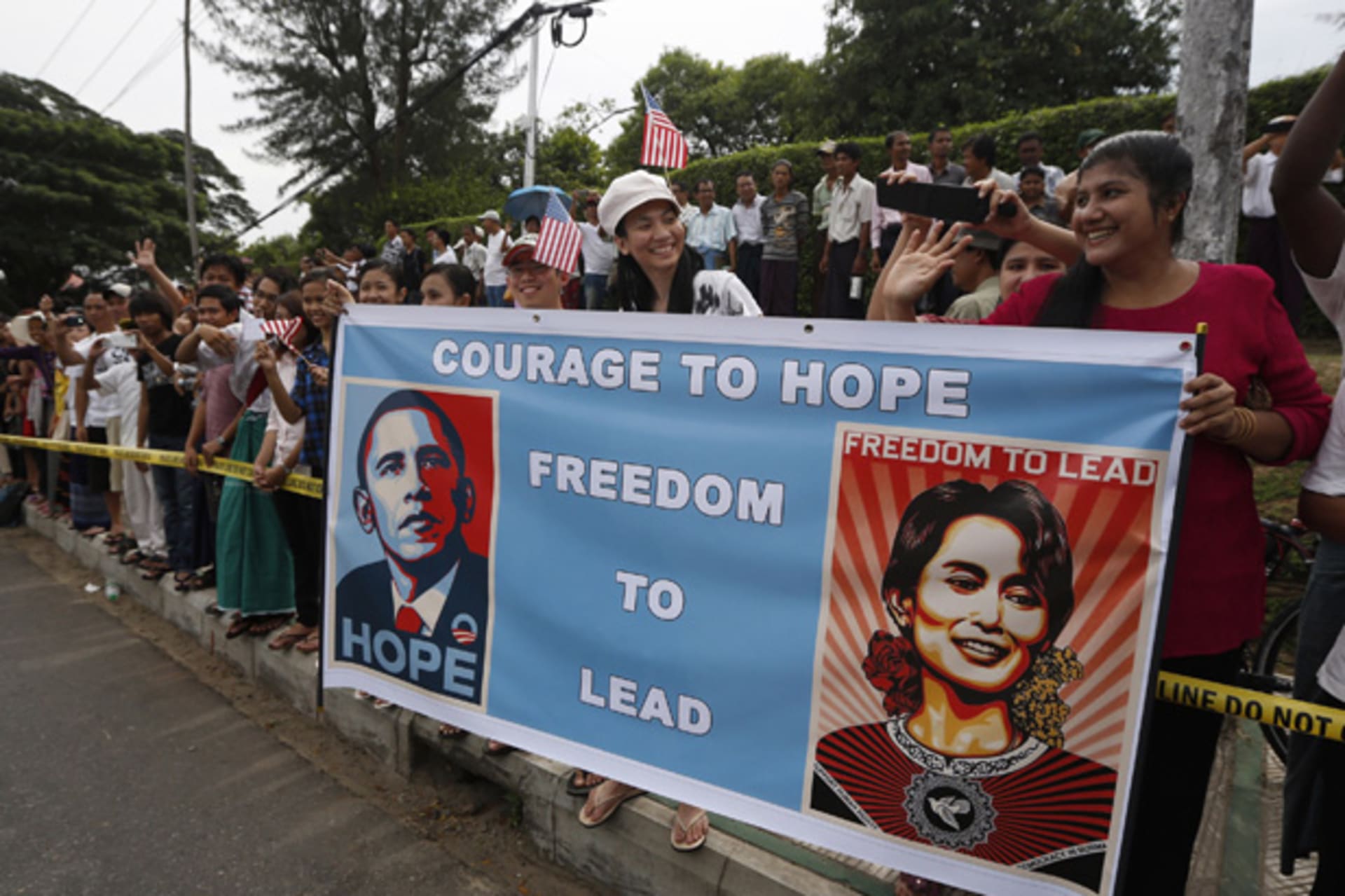 <p>Crowds line a street outside the home of Myanmar’s opposition leader Aung San Suu Kyi as U.S. president Barack Obama arrives to meet her in Yangon November 19, 2012.</p>
