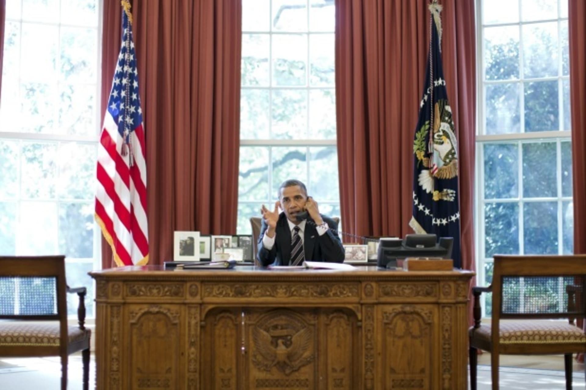 <p>U.S. President Obama speaks on the phone at the White House (Handout/Courtesy Reuters).</p>
