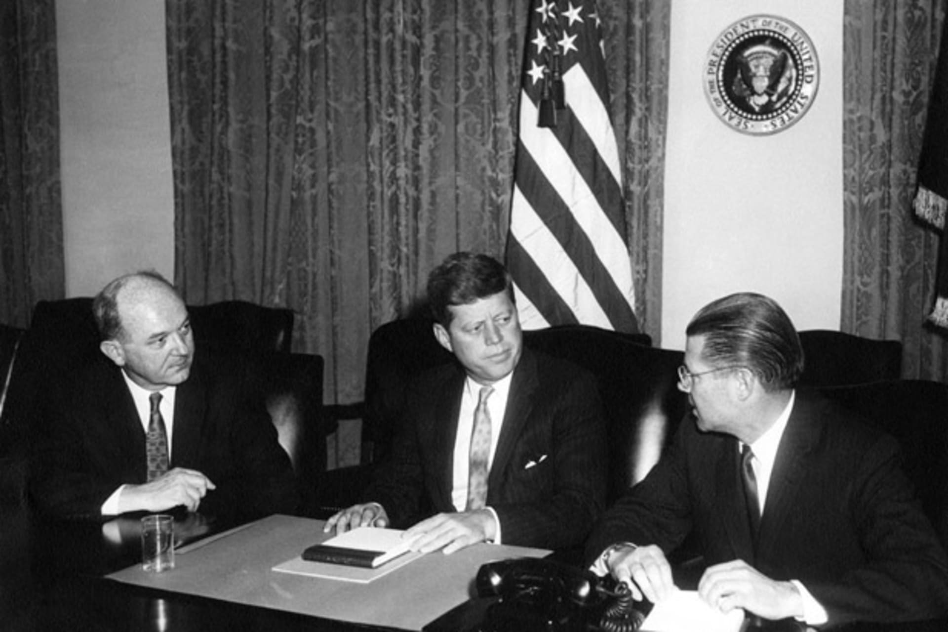 <p>Secretary of State Dean Rusk, President John F. Kennedy, and Secretary of Defense Robert McNamara meet in the Cabinet Room in January 1961.(Abbie Rowe. White House Photographs. John F. Kennedy Presidential Library and Museum, Boston)</p>
