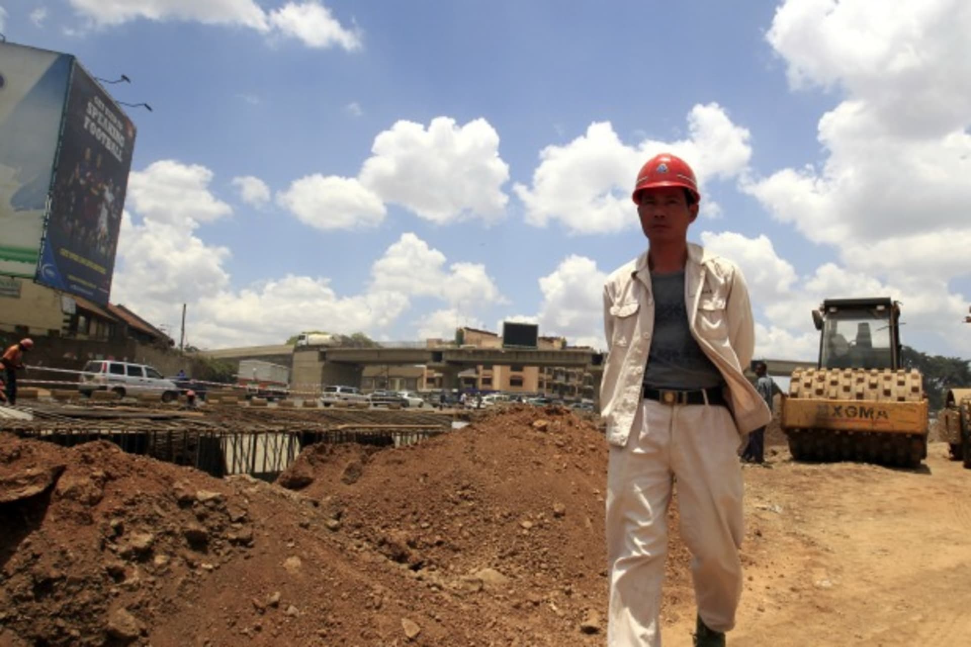 <p>A Chinese contractor walks at the site of the Nairobi-Thika highway project, under construction near Kenya’s capital Nairobi, on September 23, 2011.</p>
