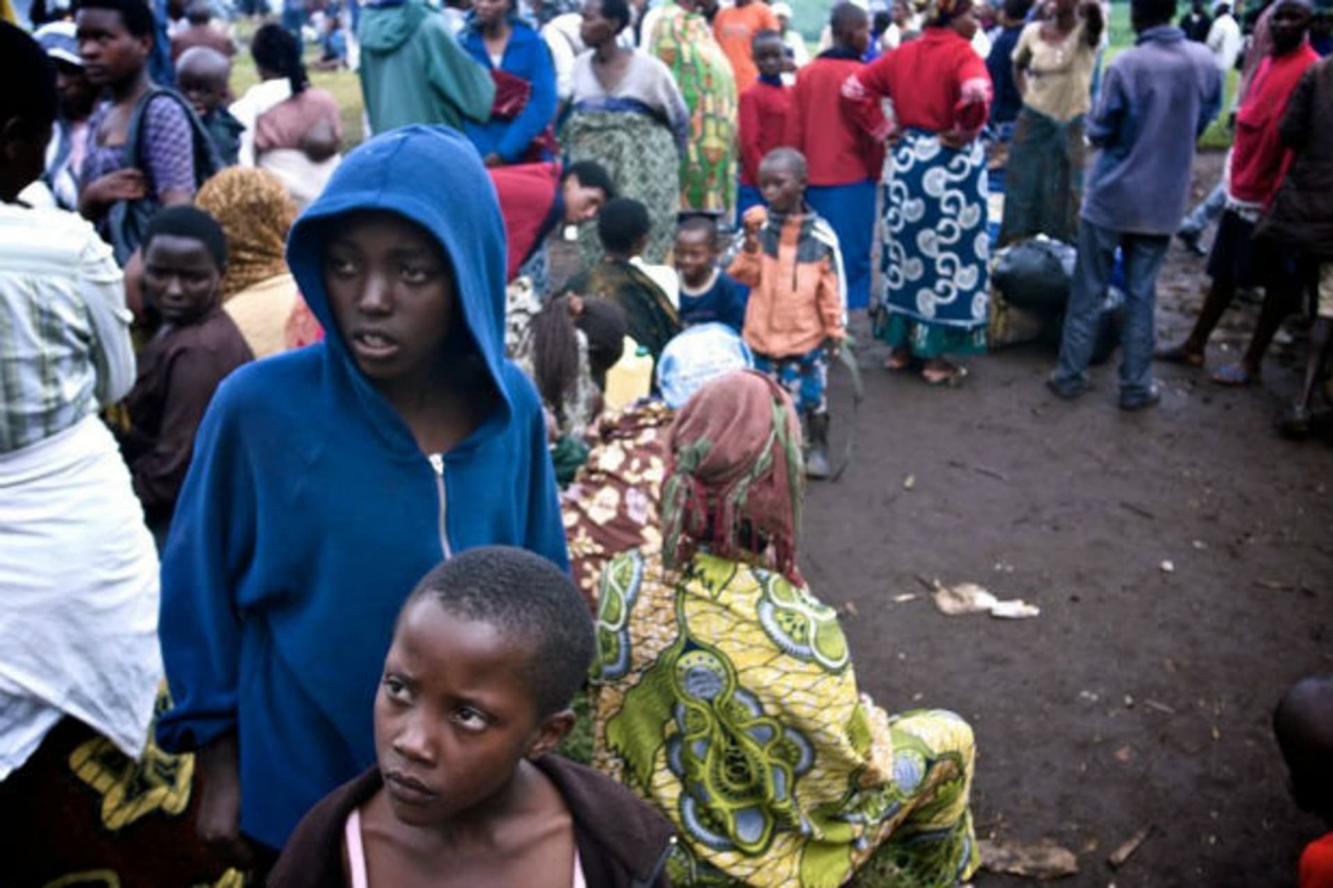 Newly arrived refugees from the Democratic Republic of Congo gather at the Nakamira transit camp from the La Corniche border crossing near Gisenyi, northwest Rwanda, May 2, 2012, after fleeing the Masisi region in Congo's North Kivu province af