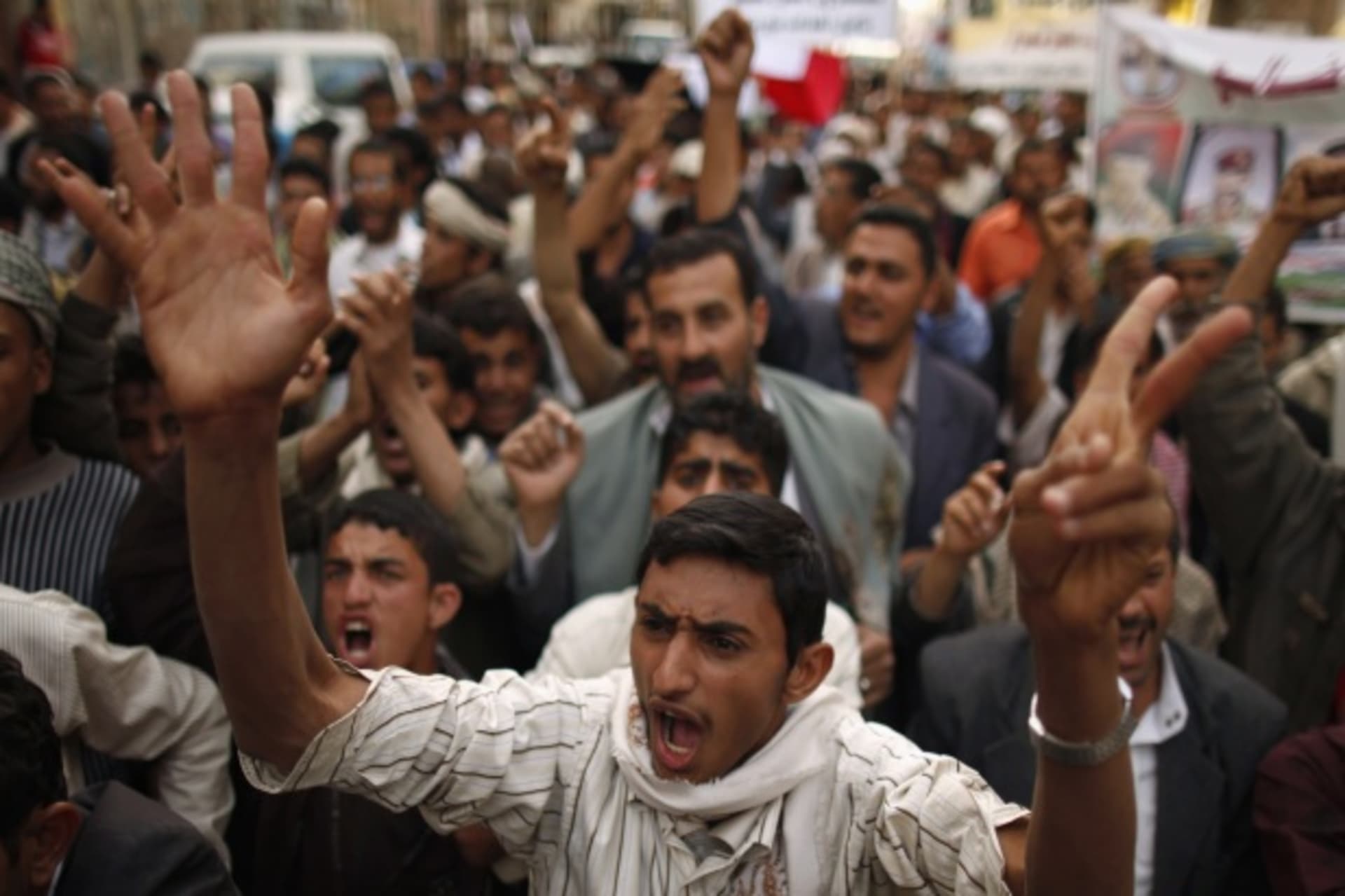 <p>Protesters shout slogans during a protest march marking an attack by security forces on an anti-government protest camp (Khaled Abdullah Ali Al Mahdi/Courtesy Reuters).</p>
