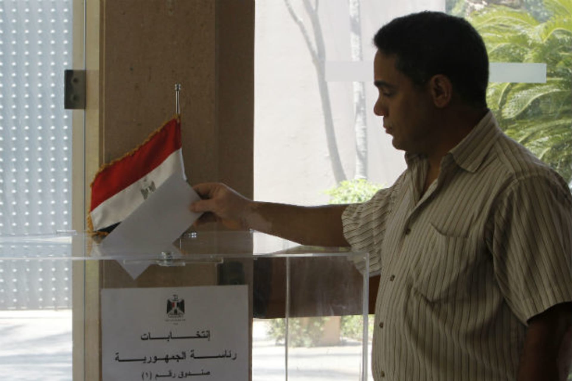 An Egyptian expatriate living in Lebanon casts his ballot at a polling station at the Egyptian embassy in Beirut on May 11, 2012, during an early voting ahead of Egypt's presidential election (Sharif Karim/Courtesy Reuters).