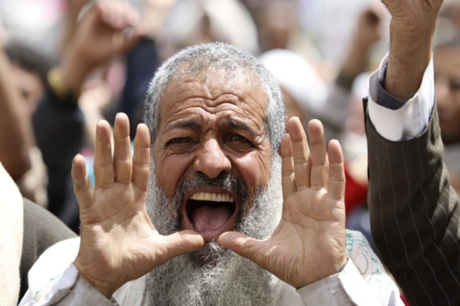 <p>An anti-government protester shouts slogans during a rally in Sanaa, Yemen (Courtesy Reuters/Mohamed Al-Sayaghi).</p>
