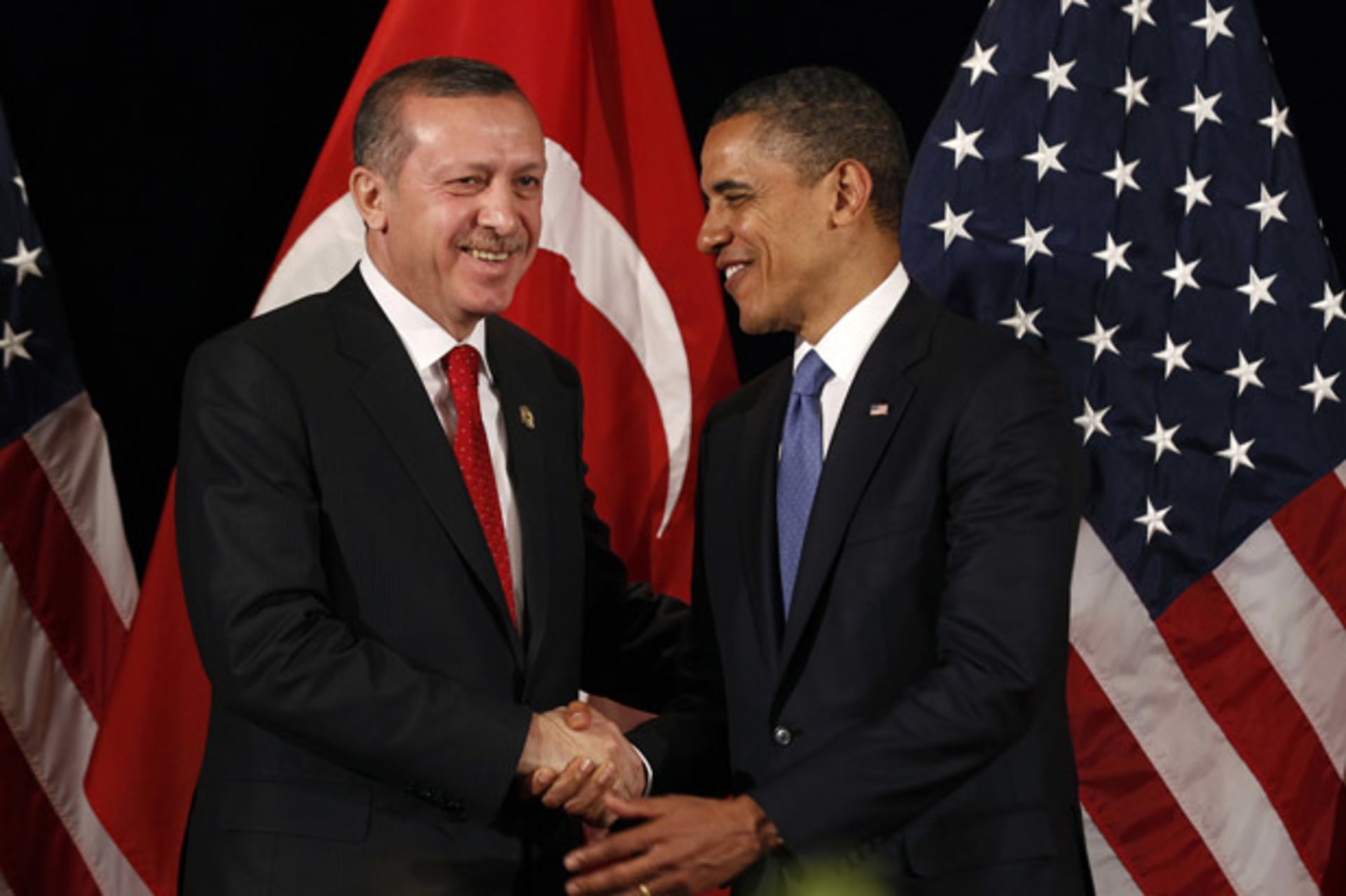 U.S. President Obama shakes hands with Turkey's PM Erdogan in Seoul