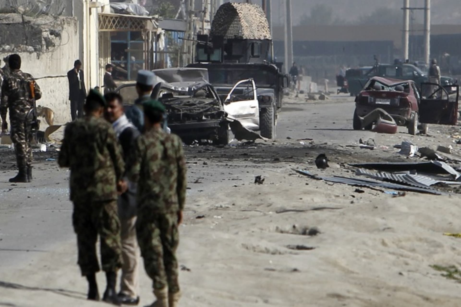<p>Afghan security forces members inspect the site of a car bomb attack in Kabul on May 2, 2012, hours after President Obama departed (Courtesy Reuters/Omar Sobhani).</p>
