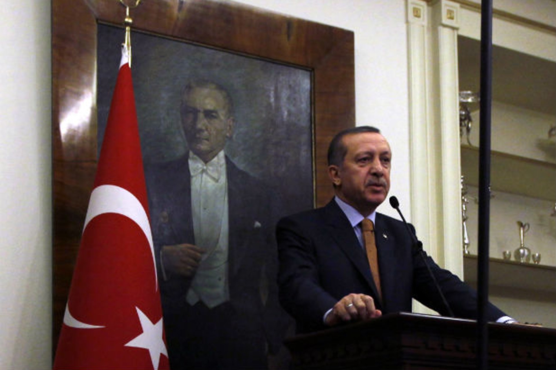 Turkey's prime minister Tayyip Erdogan, with a portrait of modern Turkey's founder Ataturk in the background, speaks during a news conference in Ankara on October 20, 2011 (Umit Bektas/Courtesy Reuters).