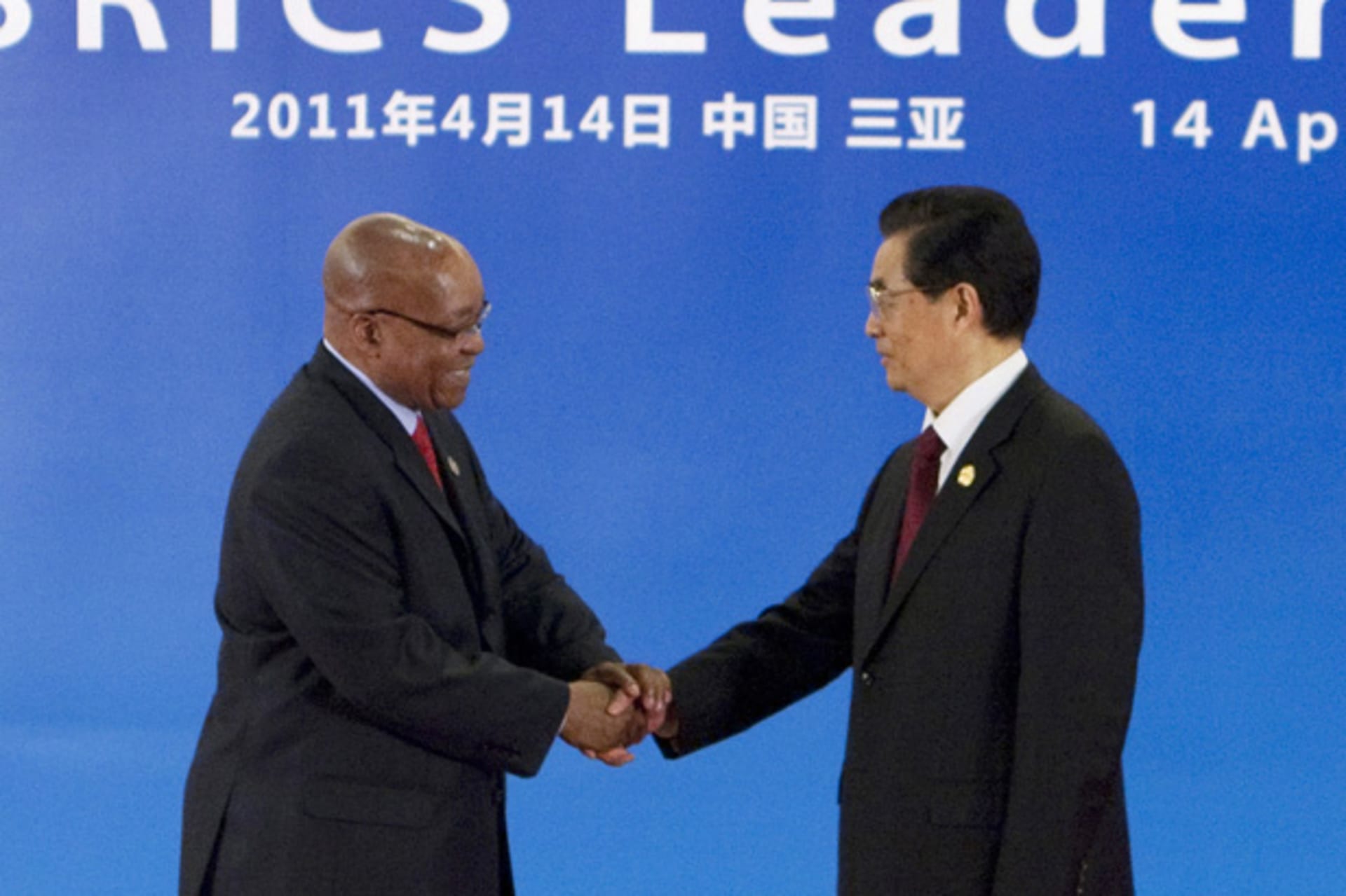 South Africa's President Zuma is greeted by China's President Hu during the BRICS Leaders Meeting in Sanya