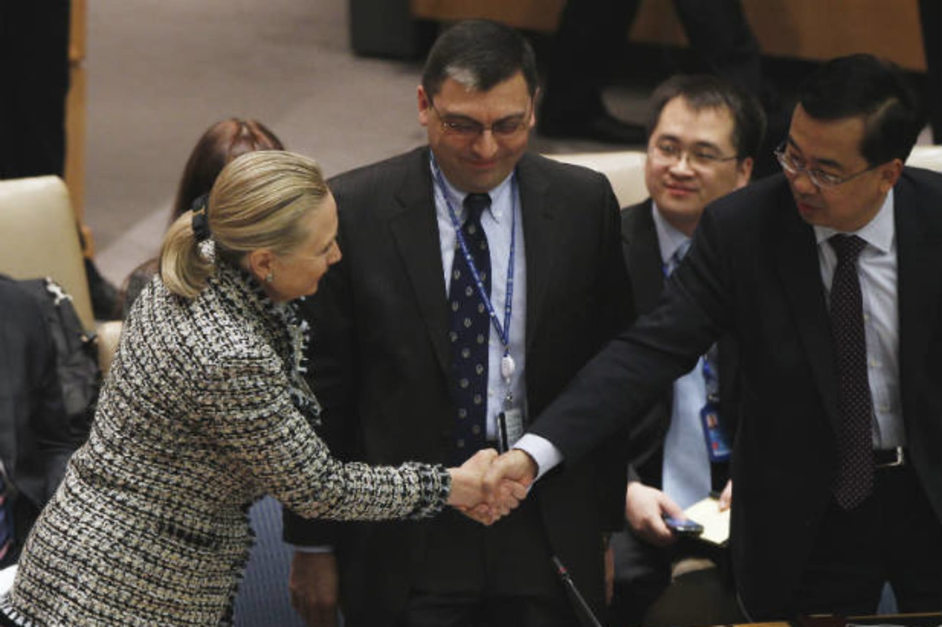 <p>U.S. Secretary of State Hillary Clinton greets Chinese Deputy Ambassador to the United Nations, Wang Min, in New York. (Lucas Jackson/courtesy Reuters)</p>
