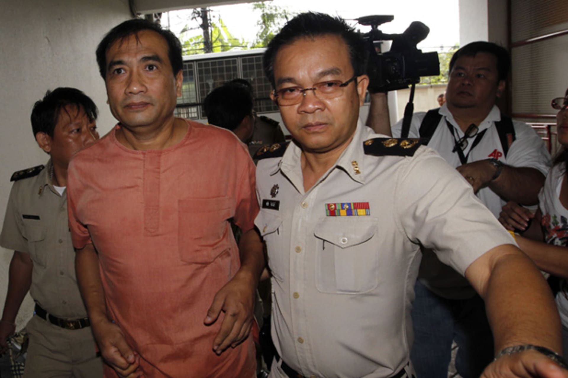 <p>Joe Gordon, a 54-year-old Thai-American citizen, arrives at Bangkok Criminal Court October 10, 2011. Gordon is charged with Lese-majeste, or insulting the monarchy, as well as contravening the country’s Computer Crimes Act.</p>
