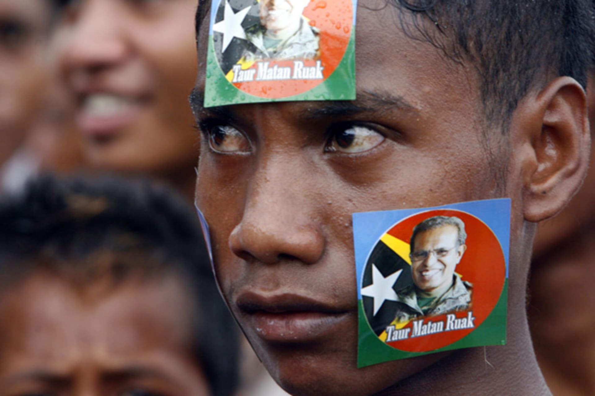 <p>A youth pastes stickers of Timor-Leste’s presidential candidate and former military commander Taur Matan Ruak on his face during a campaign rally in Dili March 10, 2012.</p>

