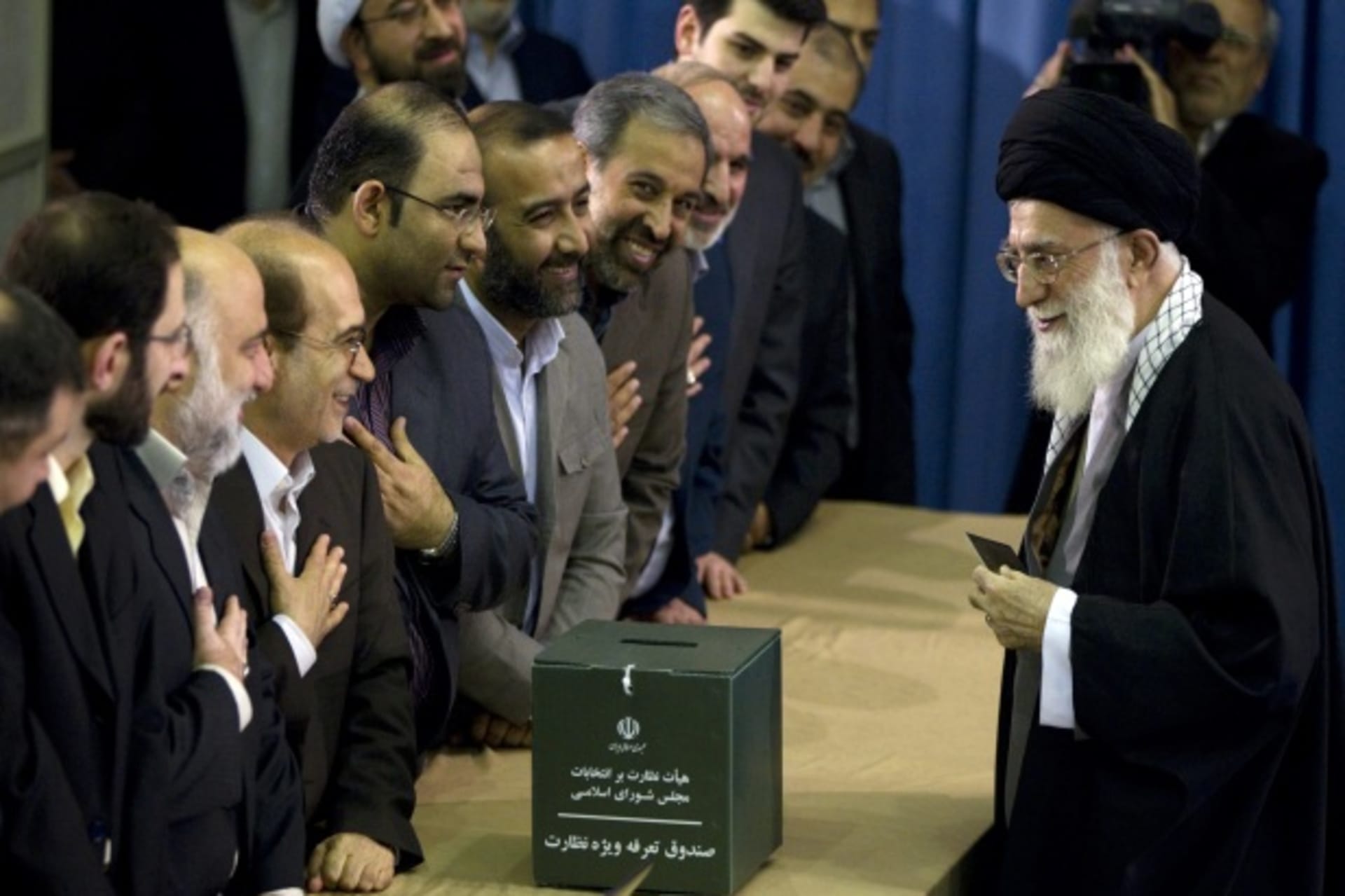 <p>Iran’s Supreme Leader Ayatollah Khamenei greets election officials as he prepares to cast his ballot in the parliamentary election in Tehran on March 2, 2012 (Courtesy Reuters/Caren Firouz).</p>
