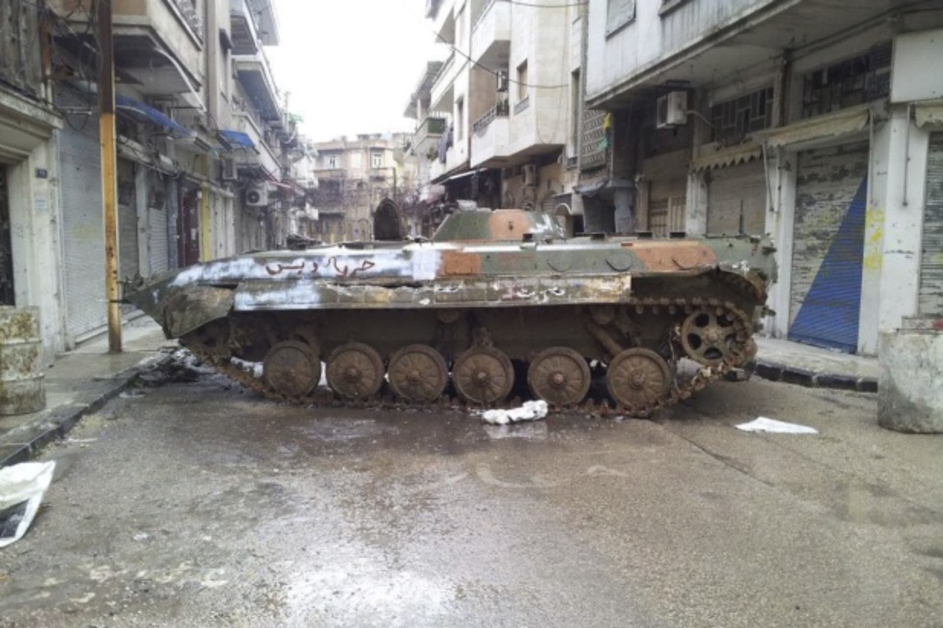 <p>A damaged tank is seen in a neighbourhood in Homs, Syria, on February 23, 2012 (Courtesy Reuters/Stringer).</p>

