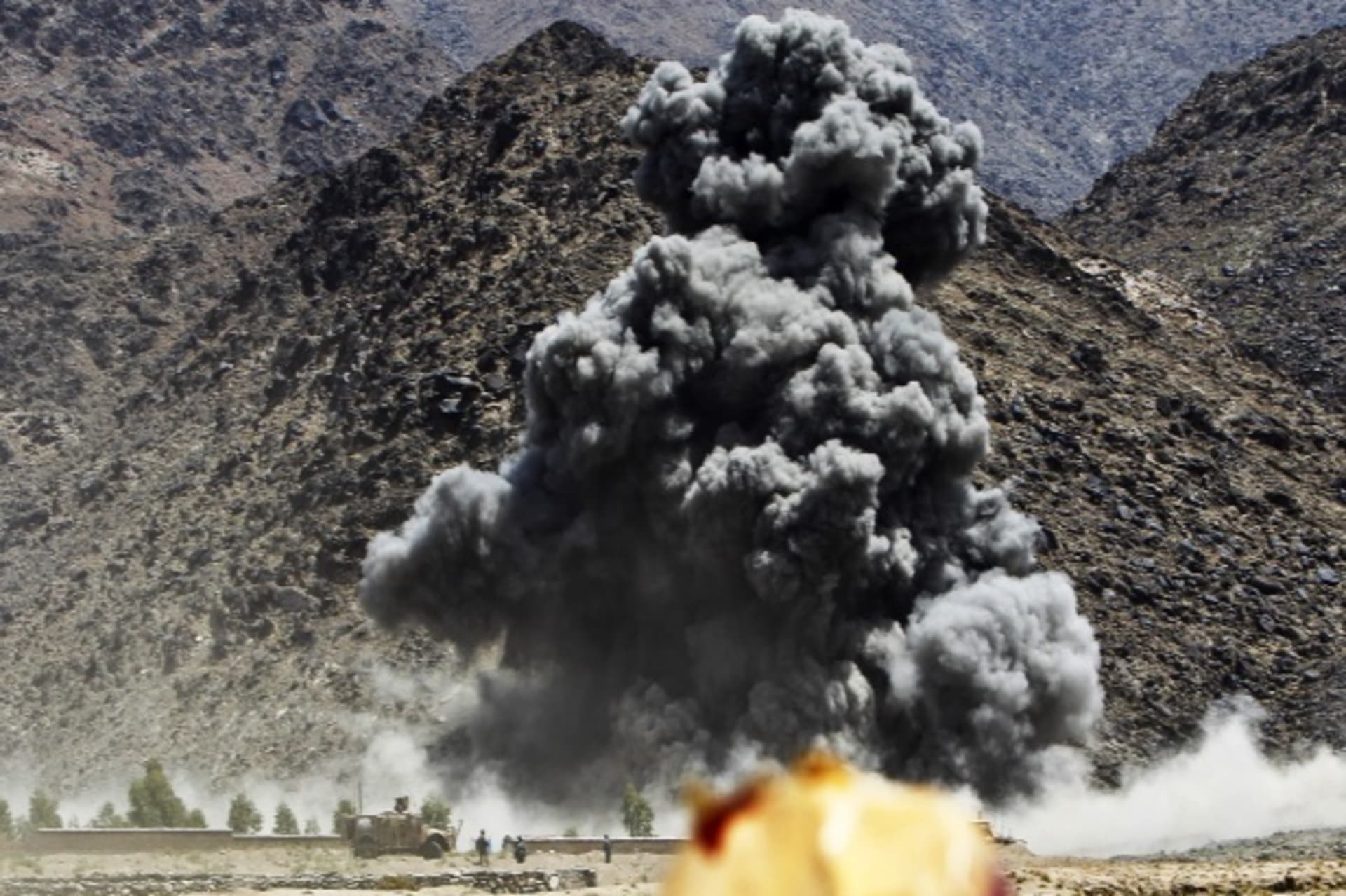 <p>An explosion after airstrikes by NATO-led forces during fighting against Taliban insurgents in Afghanistan (Courtesy Reuters/Parwiz Parwiz).</p>
