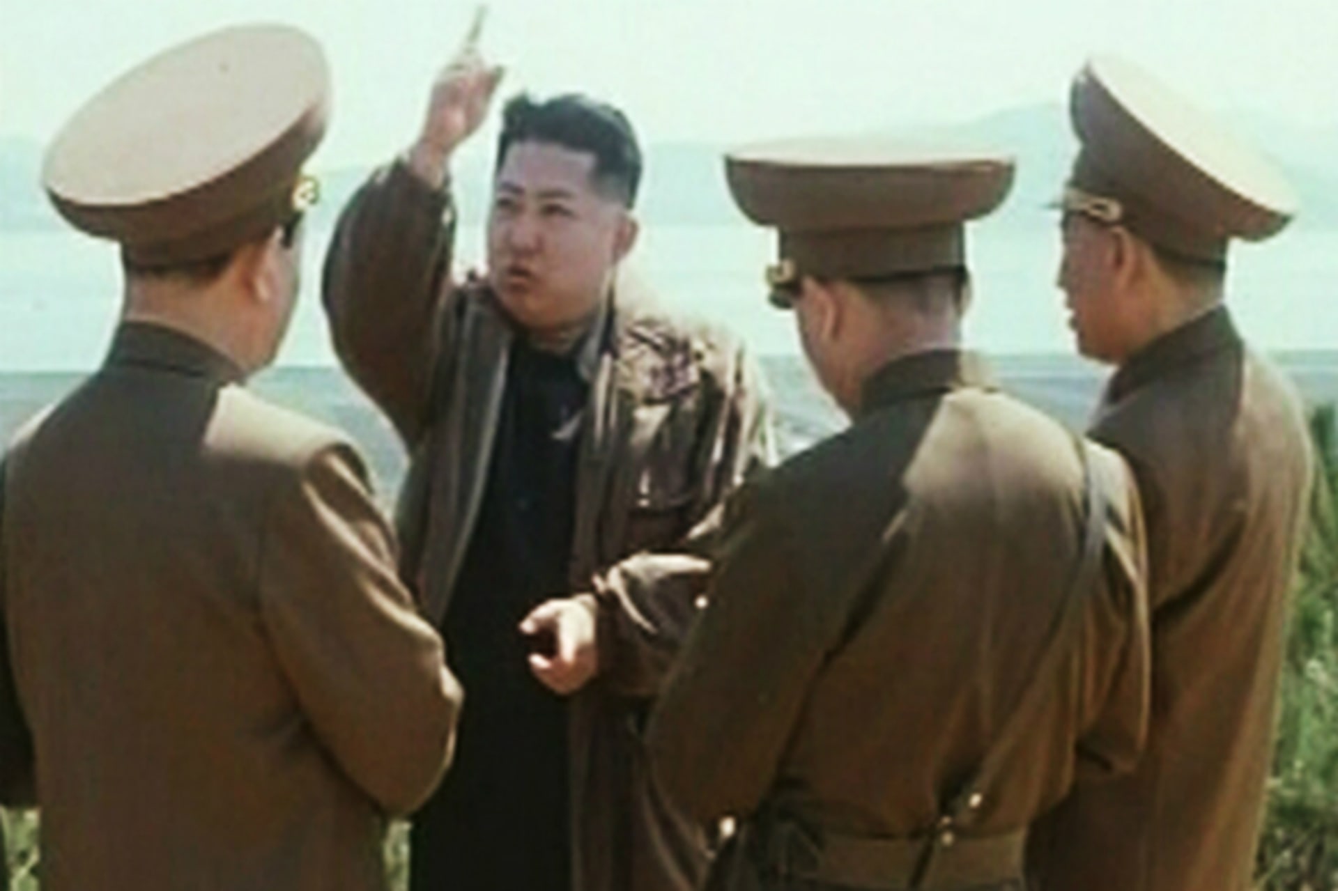 <p>New leader of North Korea Kim Jong-un speaks while surrounded by soldiers in this undated still image taken from video at an unknown location in North Korea released by North Korean state TV KRT on January 8, 2012.</p>
