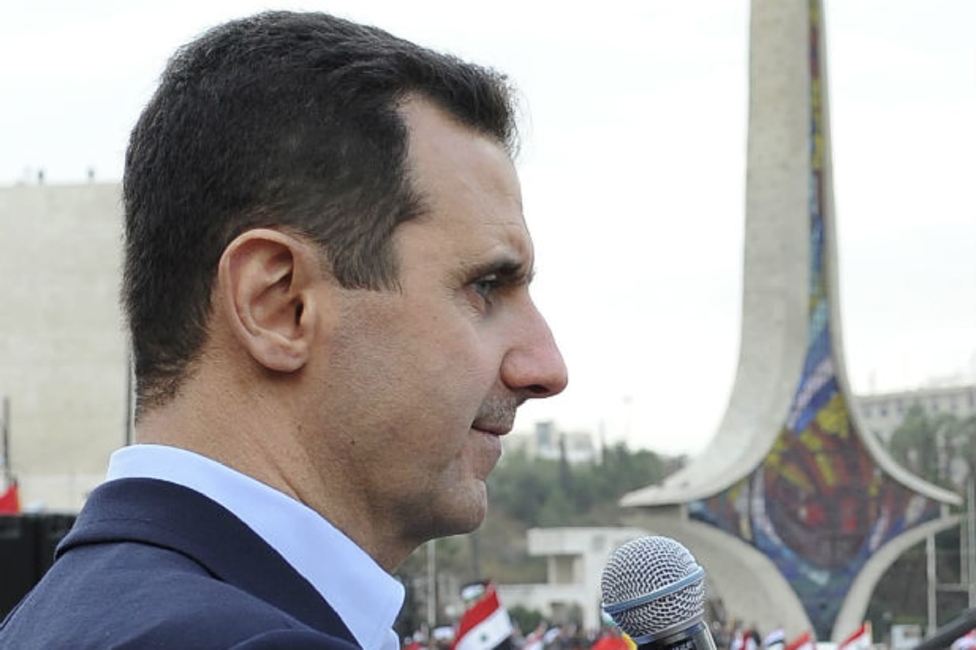 Syria's president Bashar al-Assad addresses his supporters during a surprise appearance at a rally in Umayyad Square in Damascus on January 11, 2012 (Wael Hmedan/Courtesy Reuters).