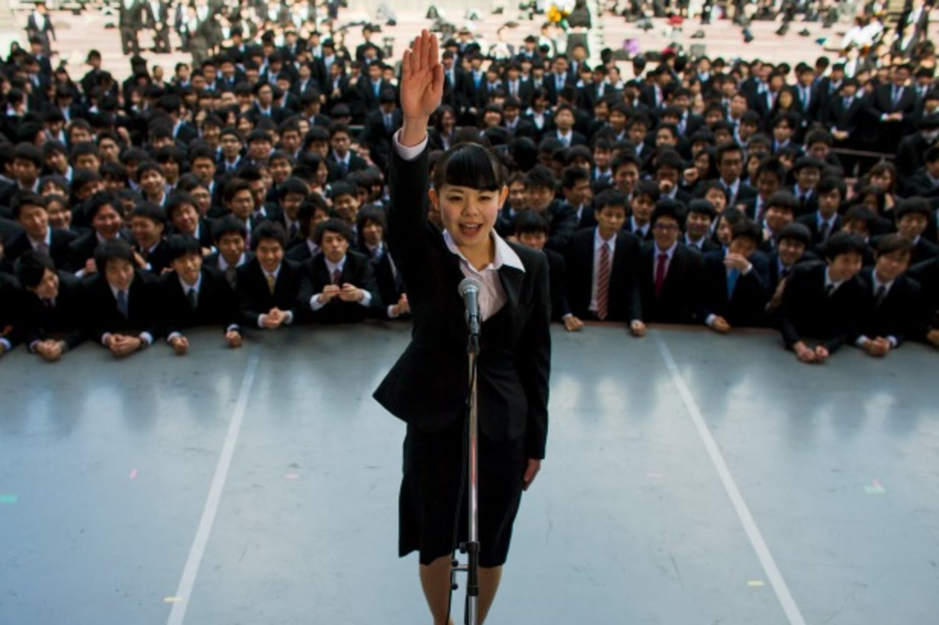 <p>Japanese college graduates attend a pep rally in Tokyo designed to boost their morale as they break into the job market, February 2015 (Thomas Peter/Reuters).</p>

