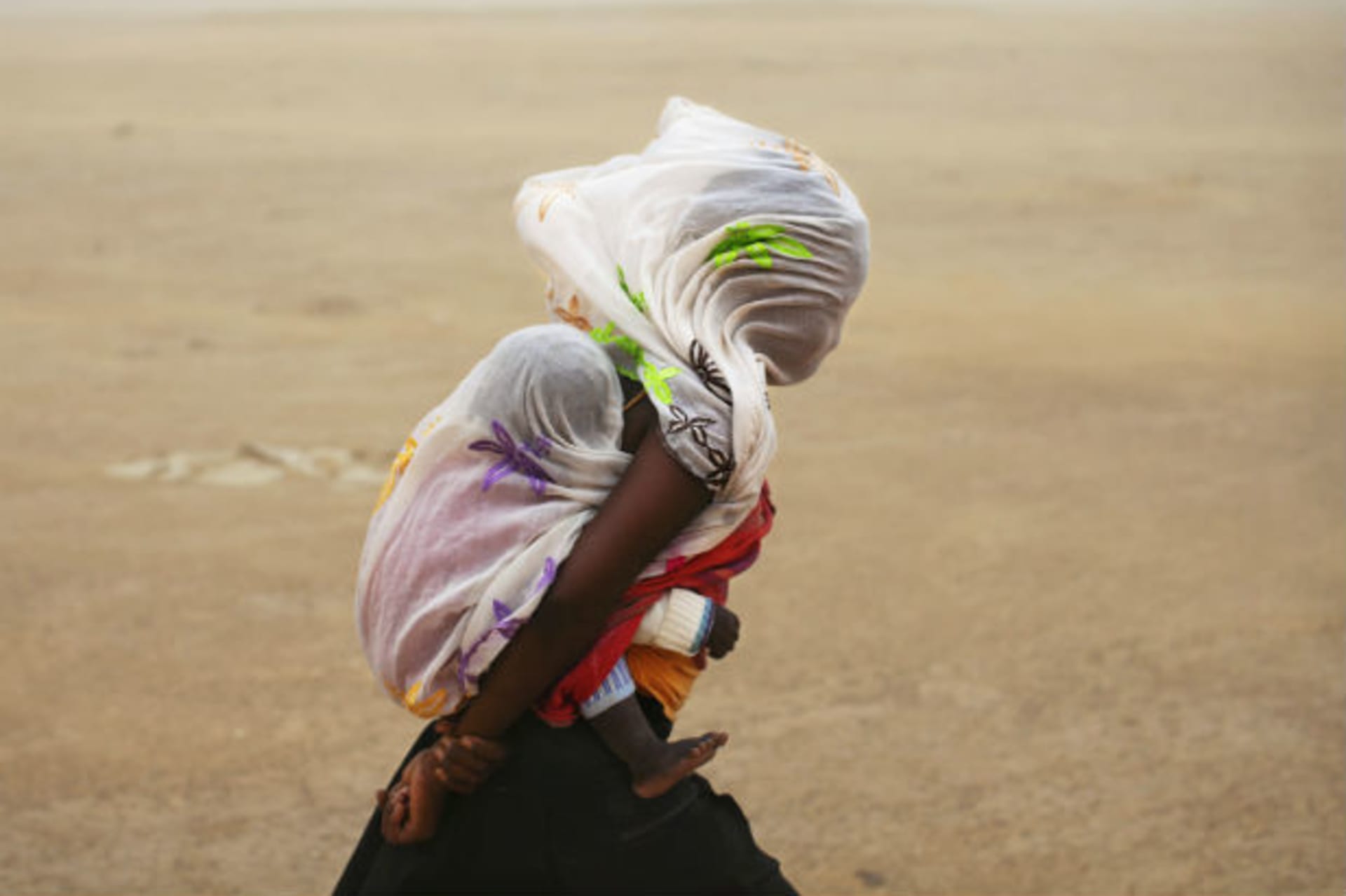 Africa - Girl Mother in Sandstorm