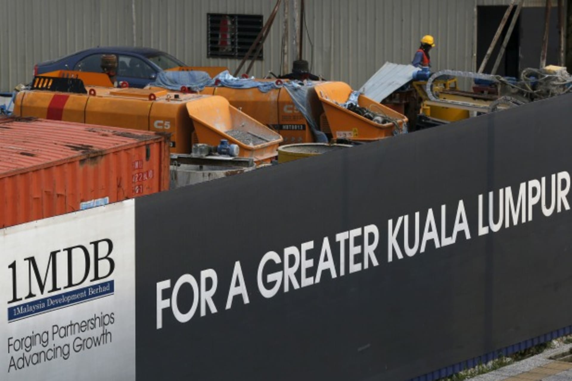 <p>Workmen are pictured on site at the 1 Malaysia Development Berhad (1MDB) flagship Tun Razak Exchange development in Kuala Lump… state fund 1MDB, claiming this was a “continuation of political sabotage.” Picture taken March 1, 2015. REUTERS/Olivia Harris</p>

