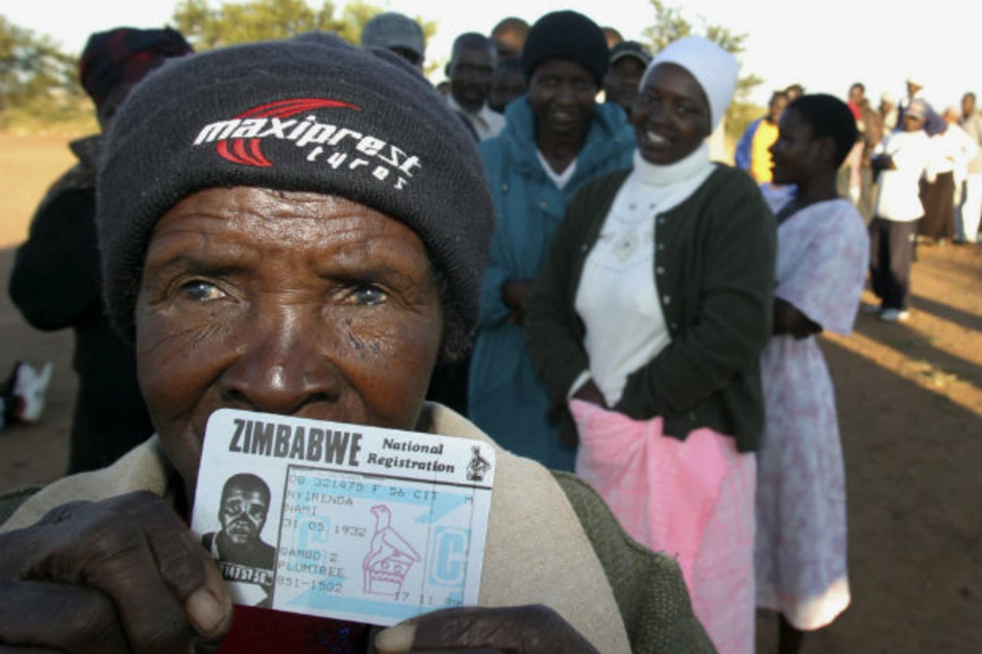 Nyirenda Nami, 76, shows her ID card as she waits to vote in Zimbabwe's second city of Bulawayo, an opposition stronghold, March 29, 2008.