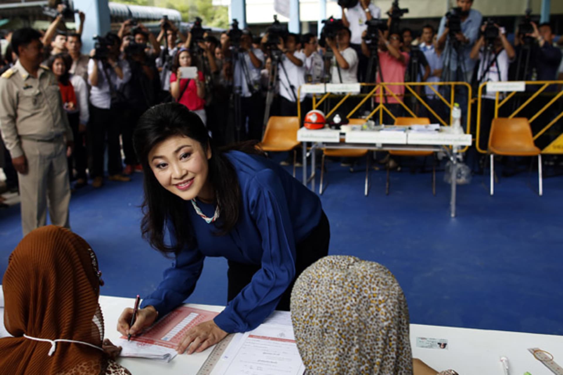 <p>Thailand’s prime minister Yingluck Shinawatra prepares to cast her ballot in the election for Bangkok’s governor in a polling station in Bangkok March 3, 2013.</p>
