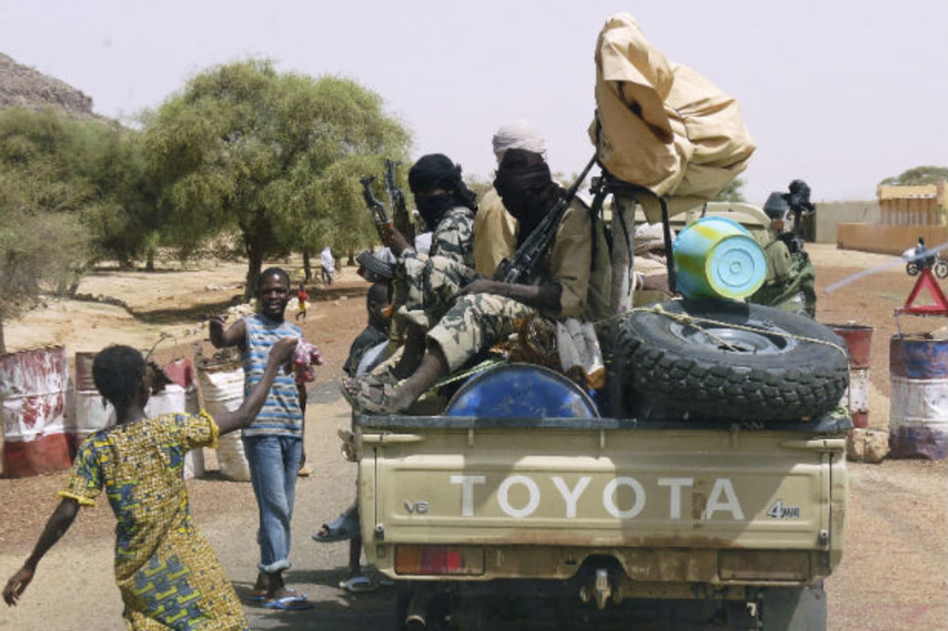 Militiaman from the Ansar Dine Islamic group sit on a vehicle in Gao in northeastern Mali 20/06/2012.