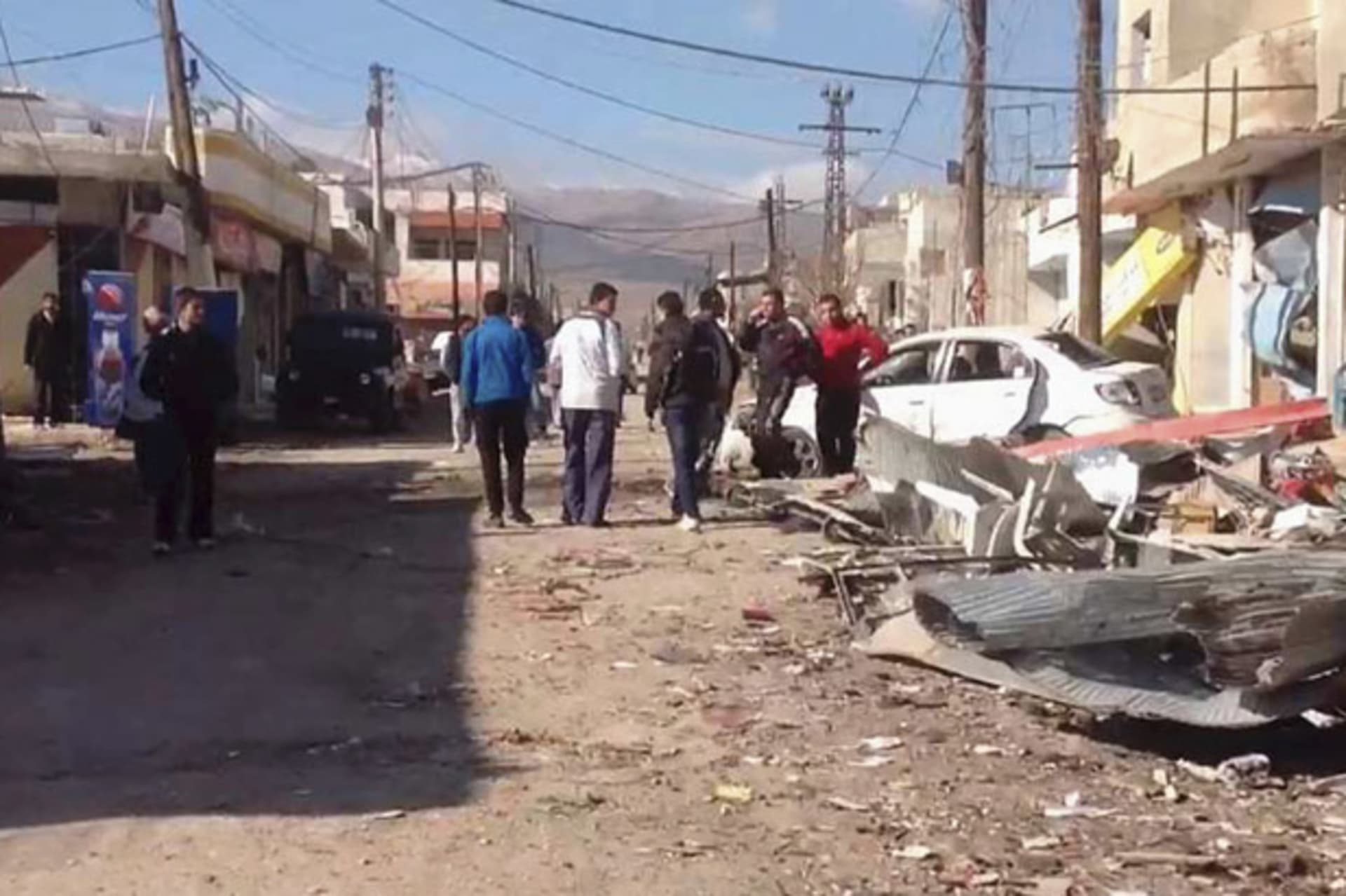 <p>A damaged area of Syria is pictured after a car bomb near Damascus on December 13 (SANA/Courtesy Reuters).</p>
