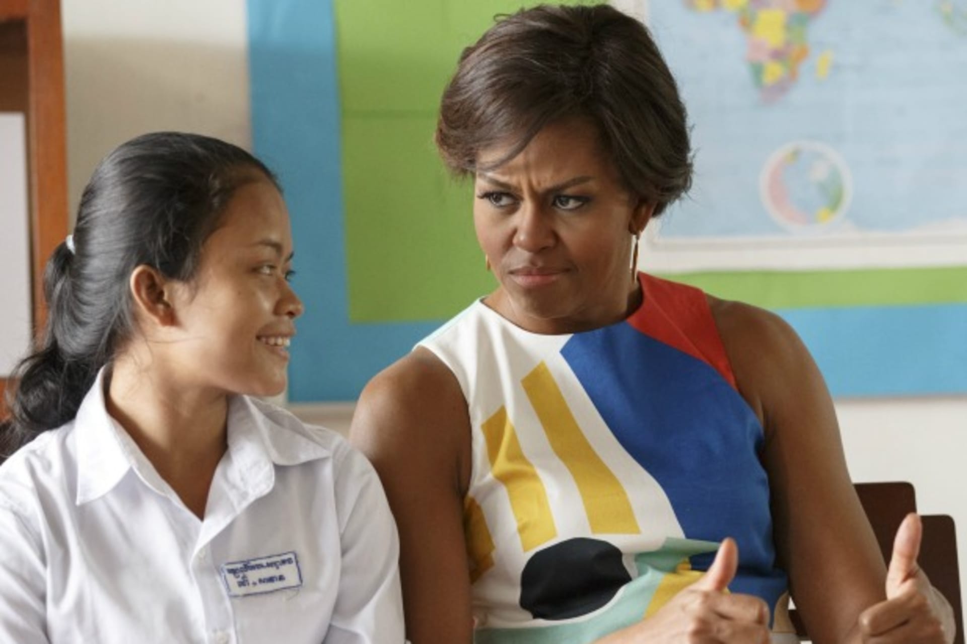 <p>U.S. First Lady Michelle Obama gestures during a visit to promote girls’ education and the “Let Girls Learn” initiative at Hun Sen Prasaat Bankong high school on the outskirts of Siem Reap, Cambodia, March 2015 (Courtesy Athit Perawongmetha/Reuters).</p>
