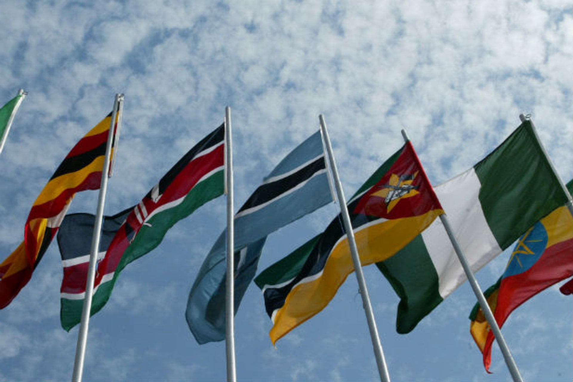 African flags blow in the wind as leaders arrive in Rwanda’s capital Kigali 13/02/2004.