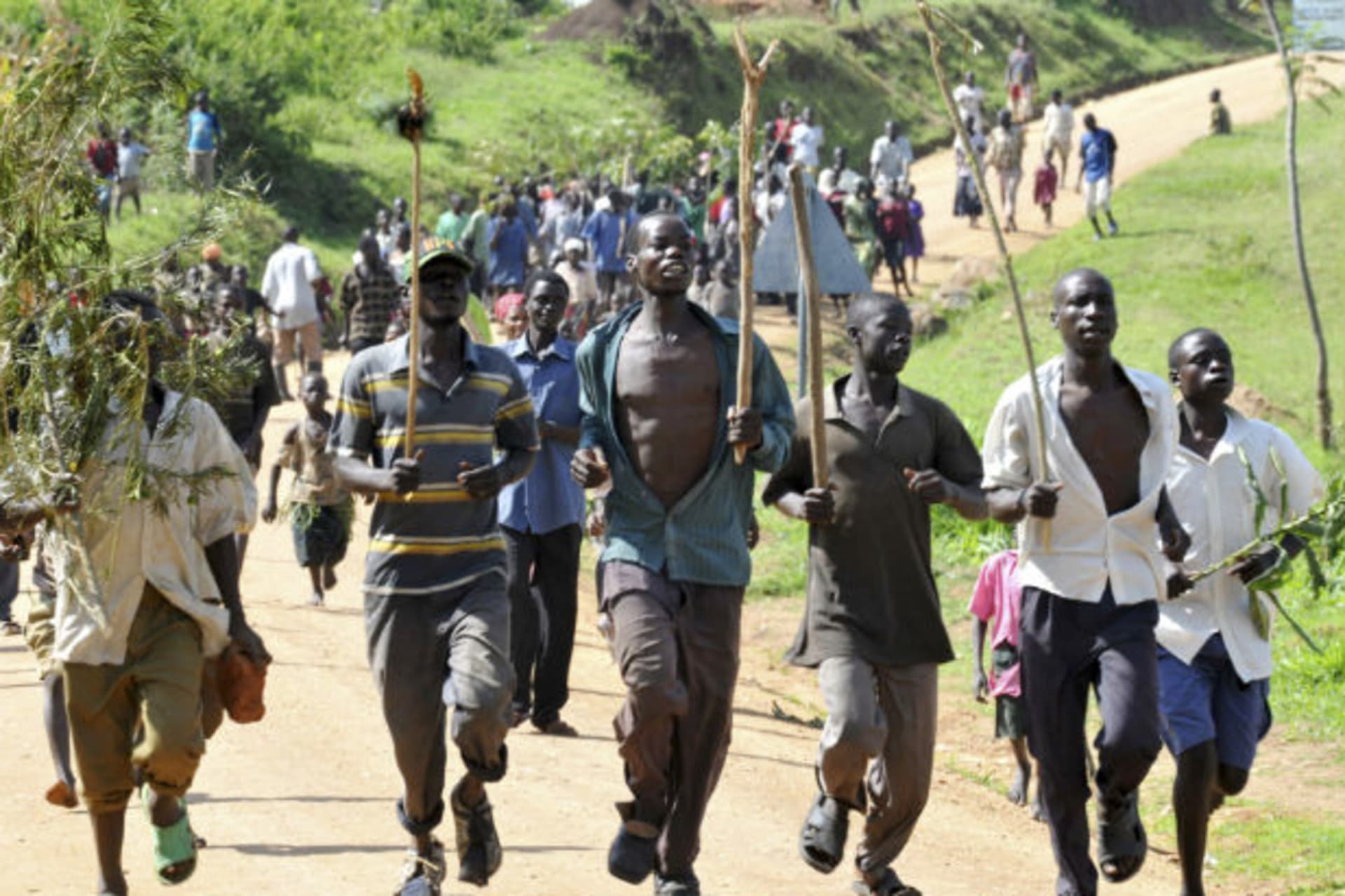 Youths from the Bagisu tribe escort Ronald Makwankwa (not in the picture) after his circumcision ceremony in Mbale, 220 km (136 miles) east of the Ugandan capital of Kampala, August 12, 2008.