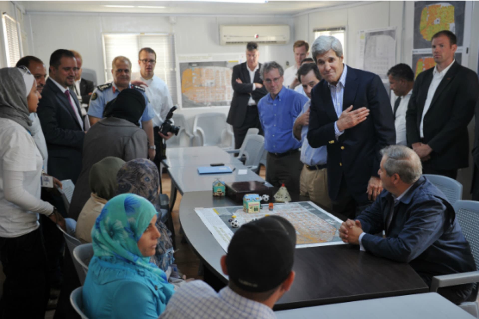 <p>U.S. Secretary of State John Kerry greets Syrian refugees</p>
