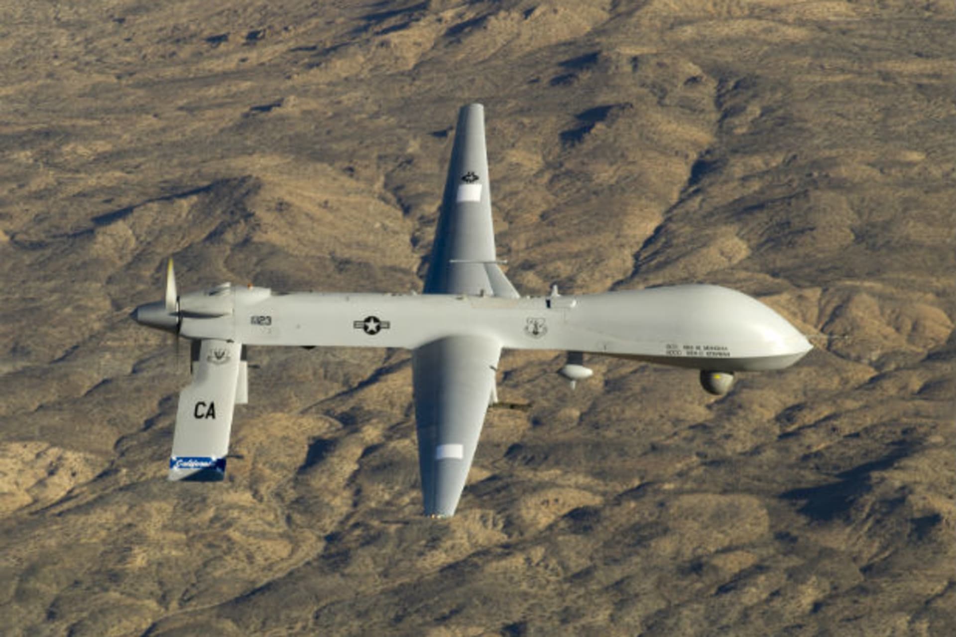 A U.S. Air Force MQ-1 Predator unmanned aerial vehicle assigned to the California Air National Guard's 163rd Reconnaissance Wing flies near the Southern California Logistics Airport in Victorville, California in this January 7, 2012.